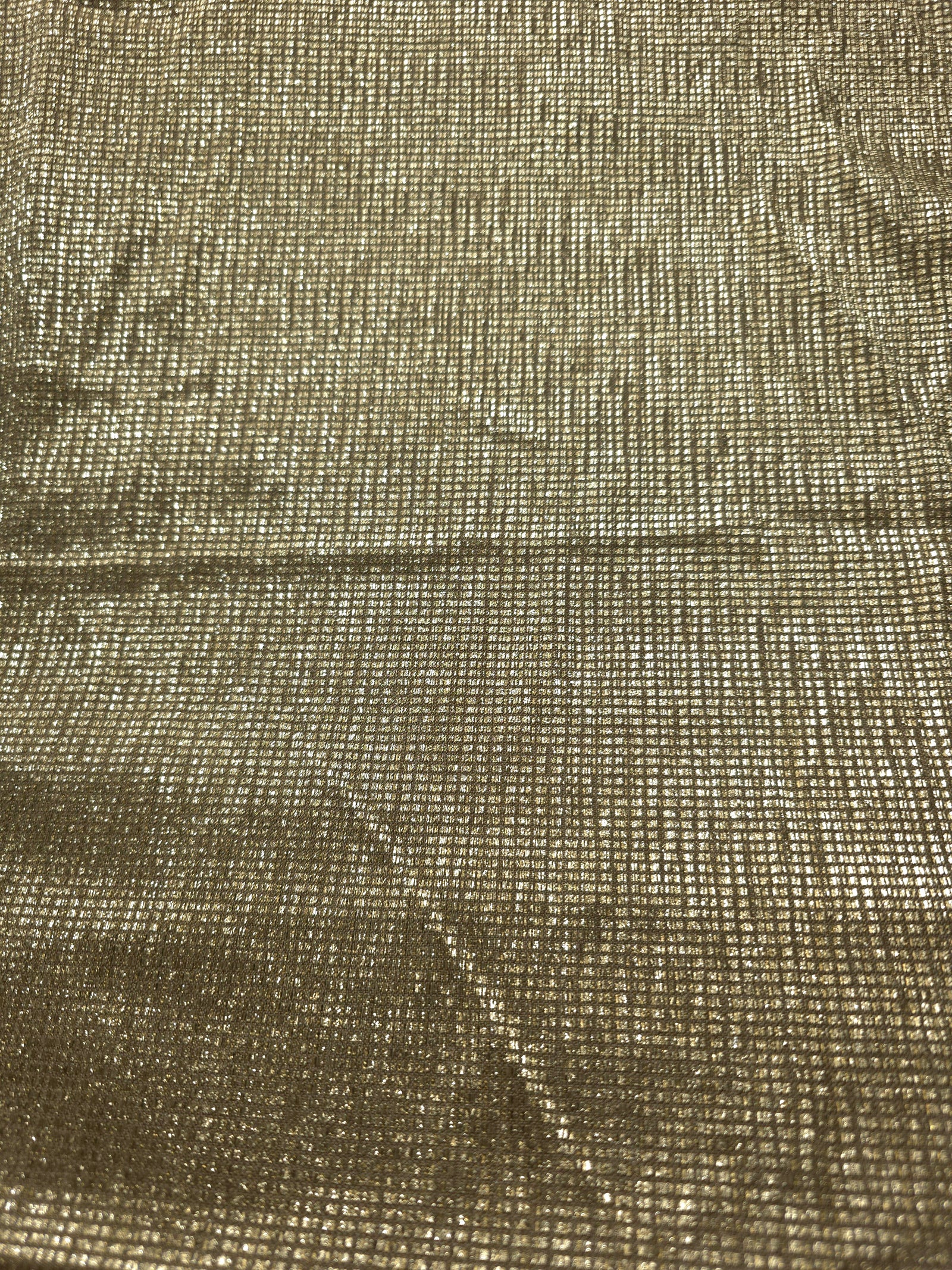 Surface detail of Champagne Gold Sheer Square Shimmer Stretch Tulle Fabric highlighting square grid scale and lightweight tulle texture