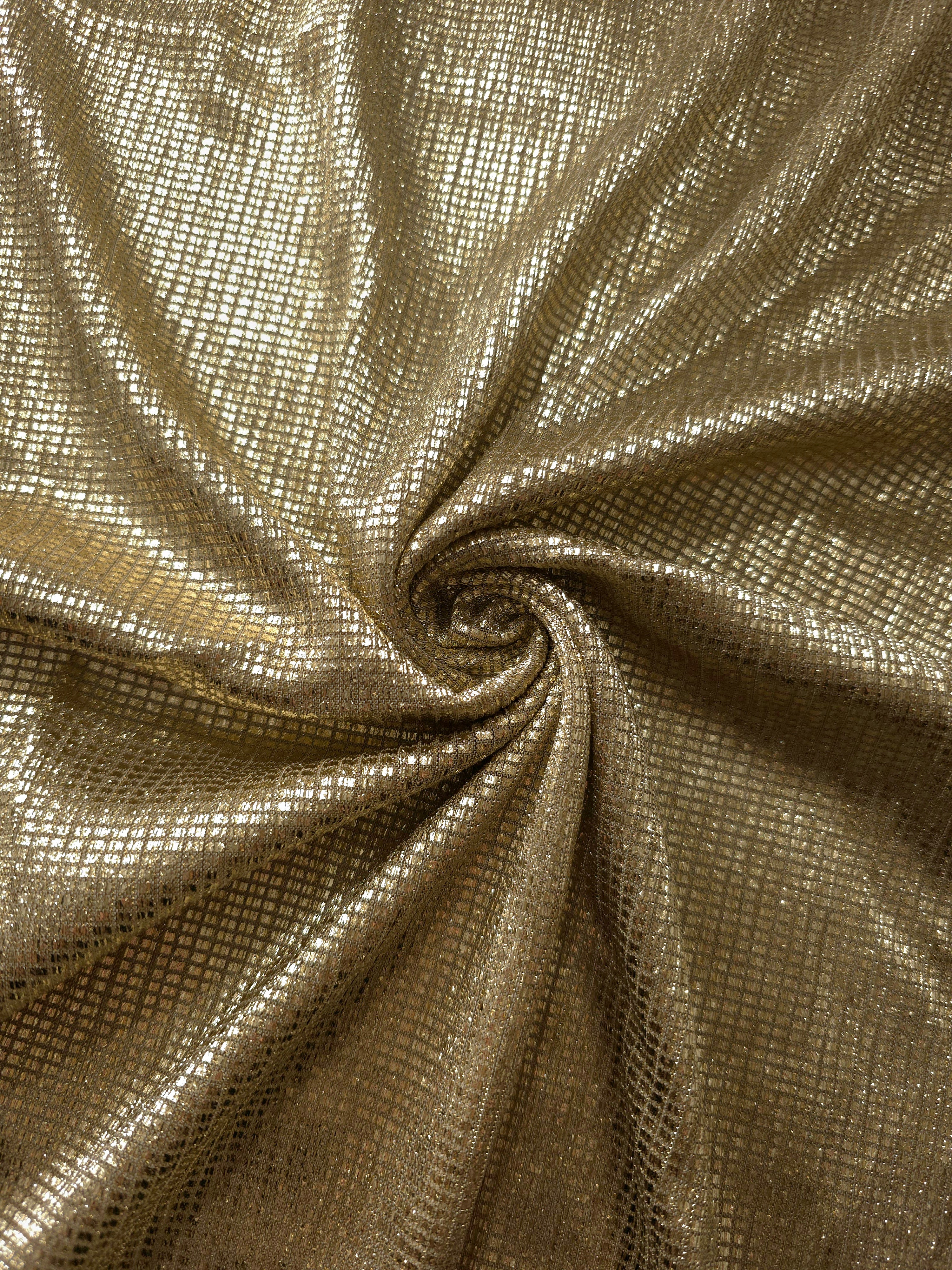 Swirl-draped Champagne Gold Sheer Square Shimmer Stretch Tulle Fabric showing structured square reflections moving through soft folds