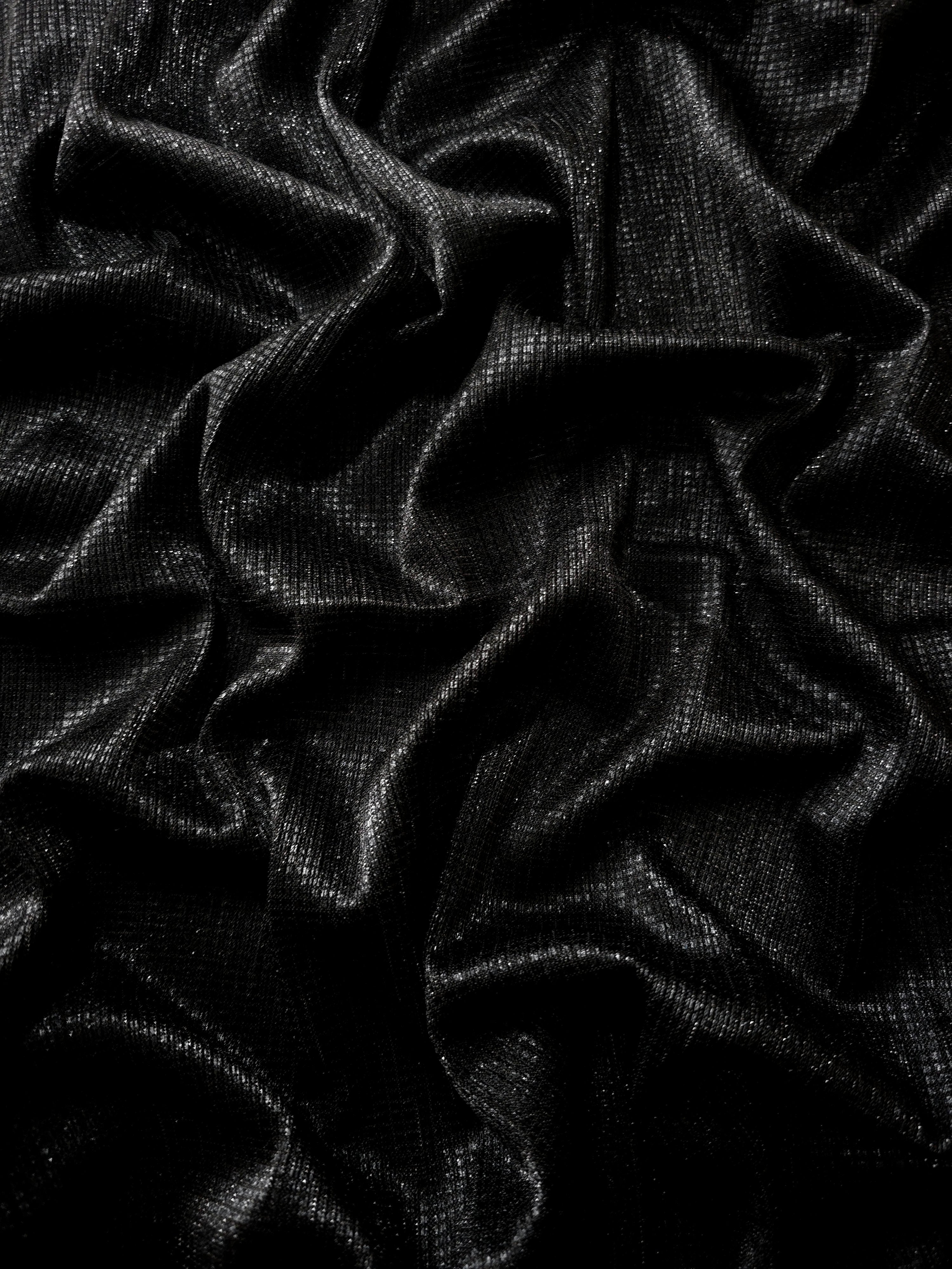 Draped Charcoal Silver Sheer Square Shimmer Stretch Tulle Fabric showing a geometric reflective grid across fluid folds