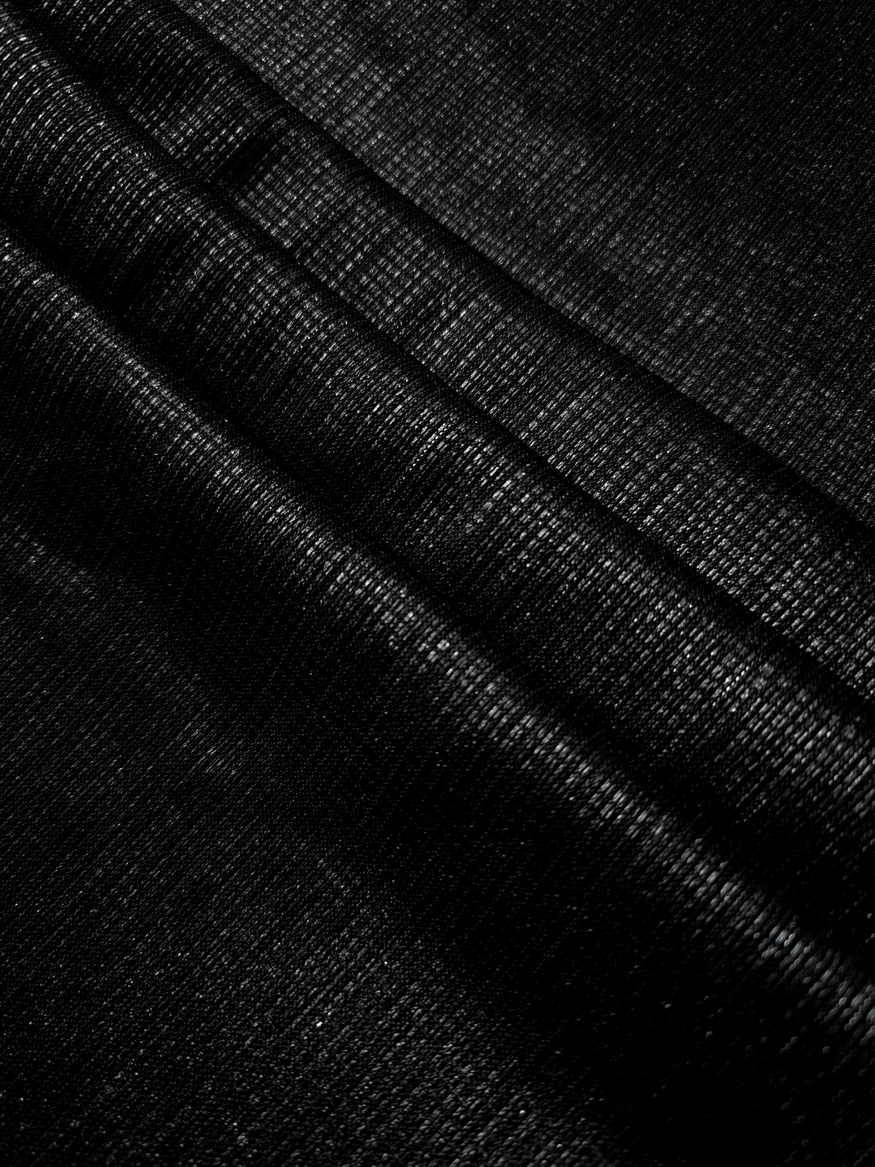 Layered Charcoal Silver Sheer Square Shimmer Stretch Tulle Fabric showing overlapping geometry, denser shimmer and translucent depth