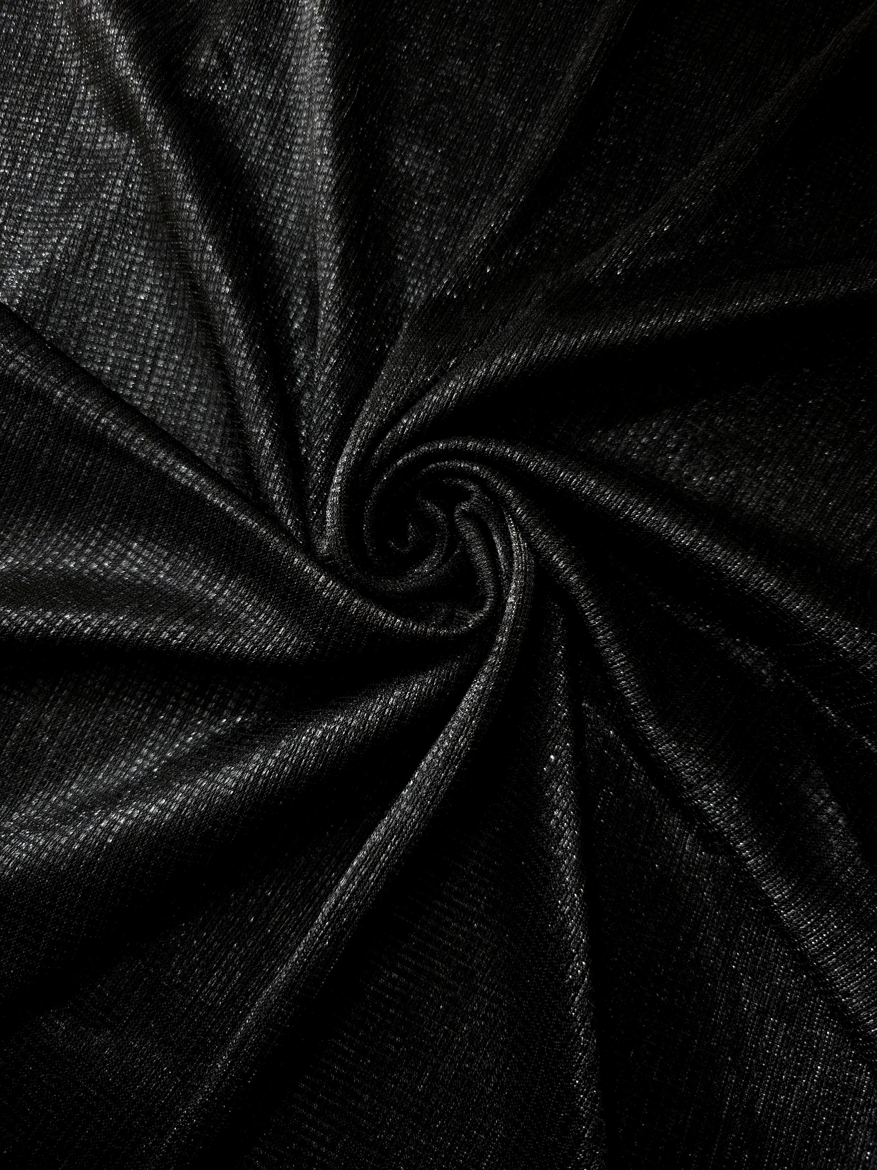 Swirl-draped Charcoal Silver Sheer Square Shimmer Stretch Tulle Fabric showing structured square reflections moving through soft folds