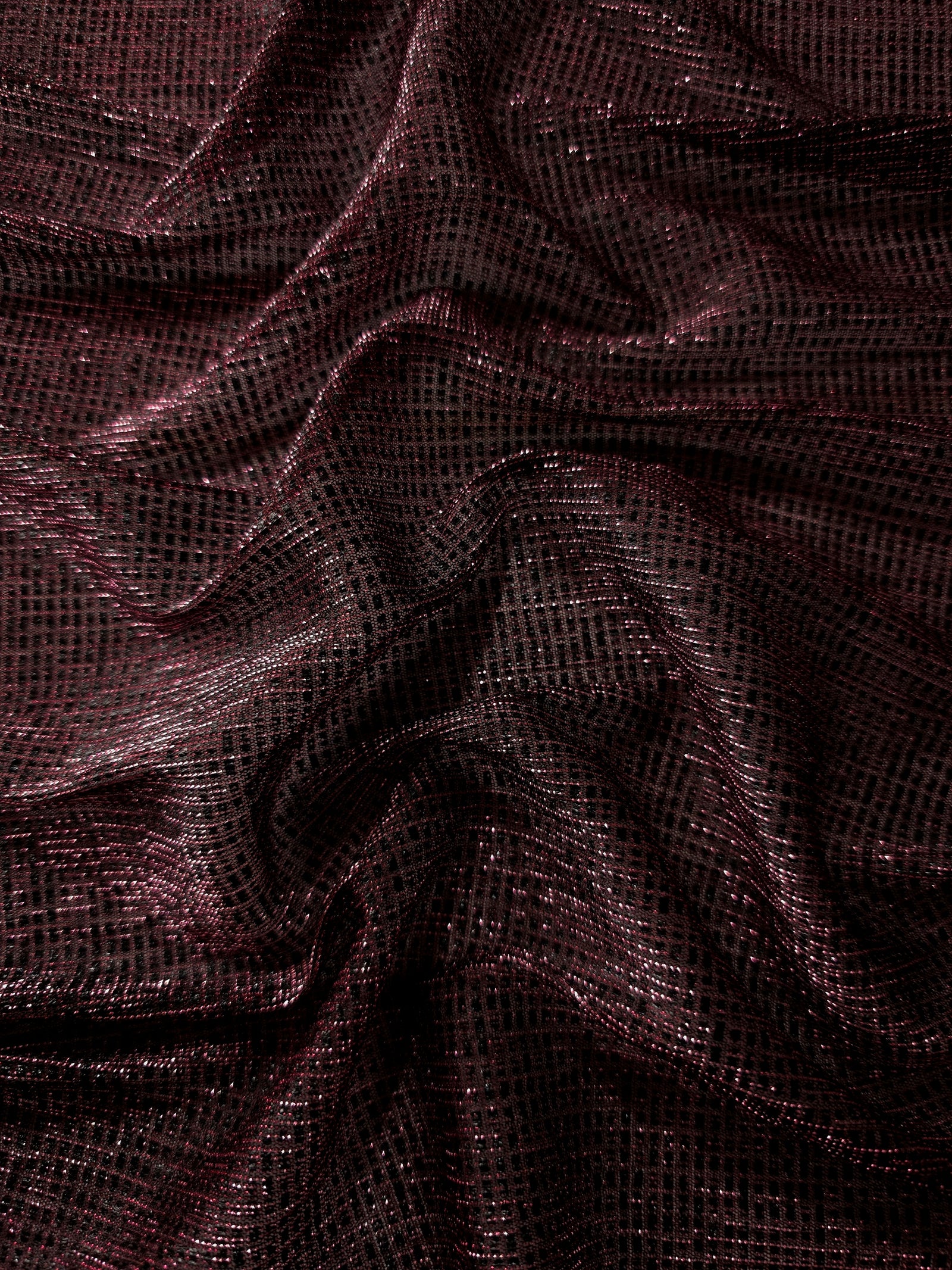 Draped Dark Pink Sheer Square Shimmer Stretch Tulle Fabric showing a geometric reflective grid across fluid folds