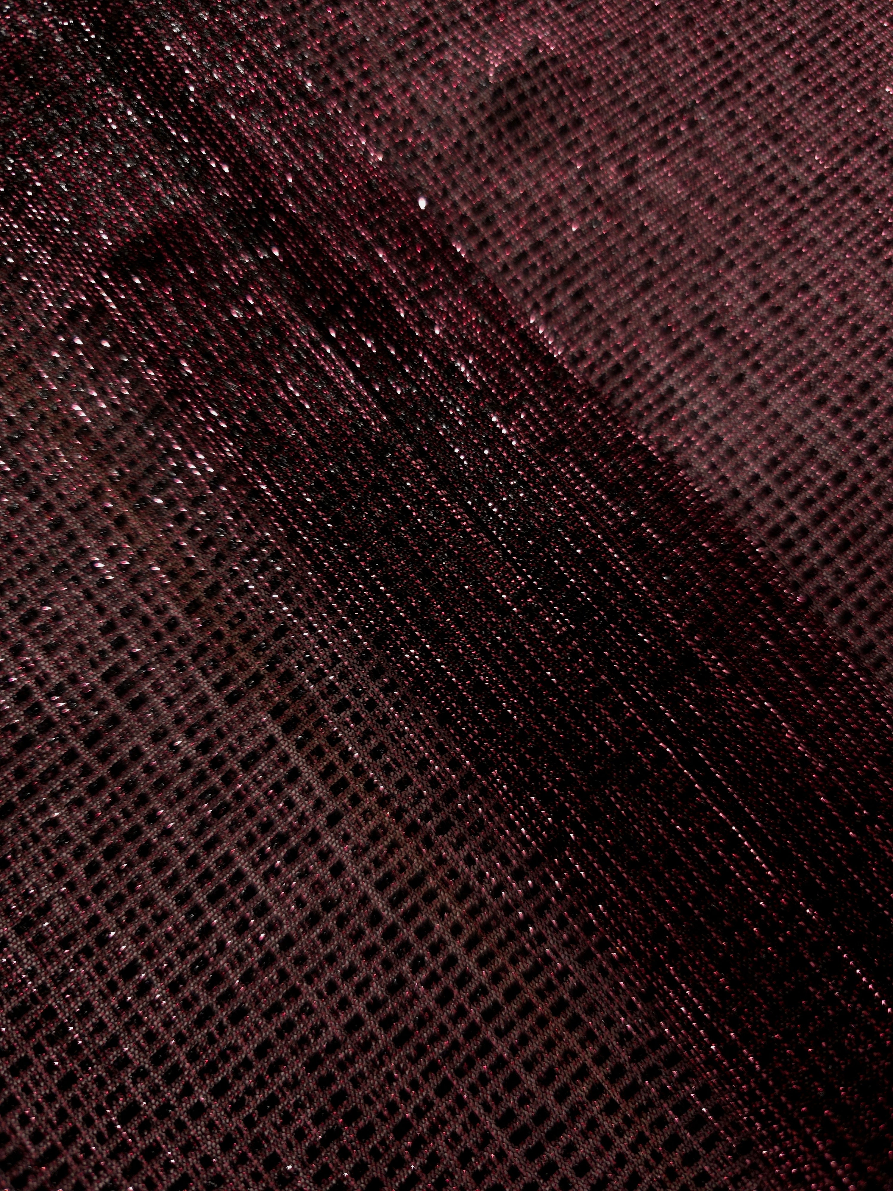 Swirl-draped Dark Pink Sheer Square Shimmer Stretch Tulle Fabric showing structured square reflections moving through soft folds