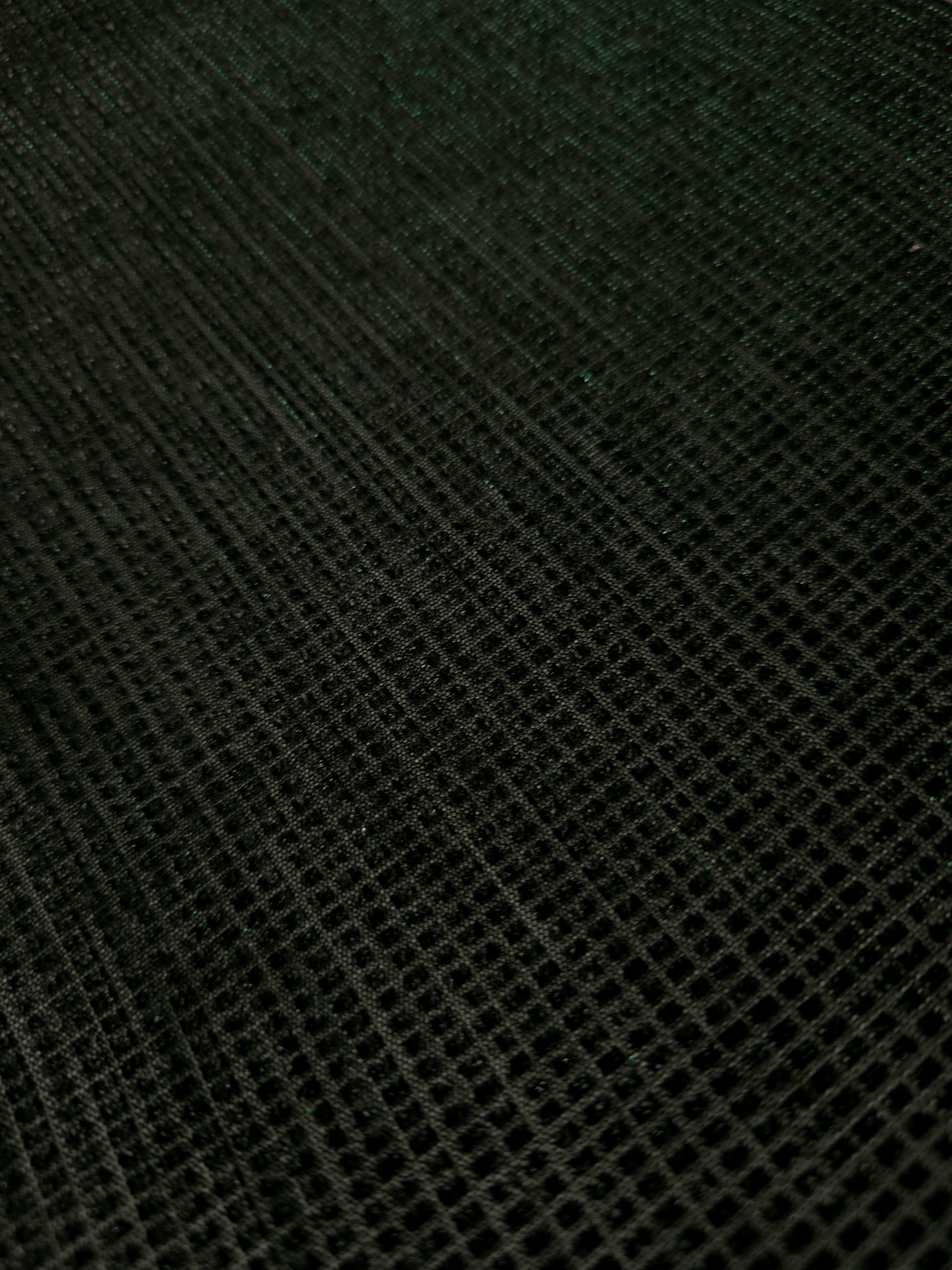 Close-up of Deep Emerald Sheer Square Shimmer Stretch Tulle Fabric revealing the square shimmer repeat and fine transparent mesh