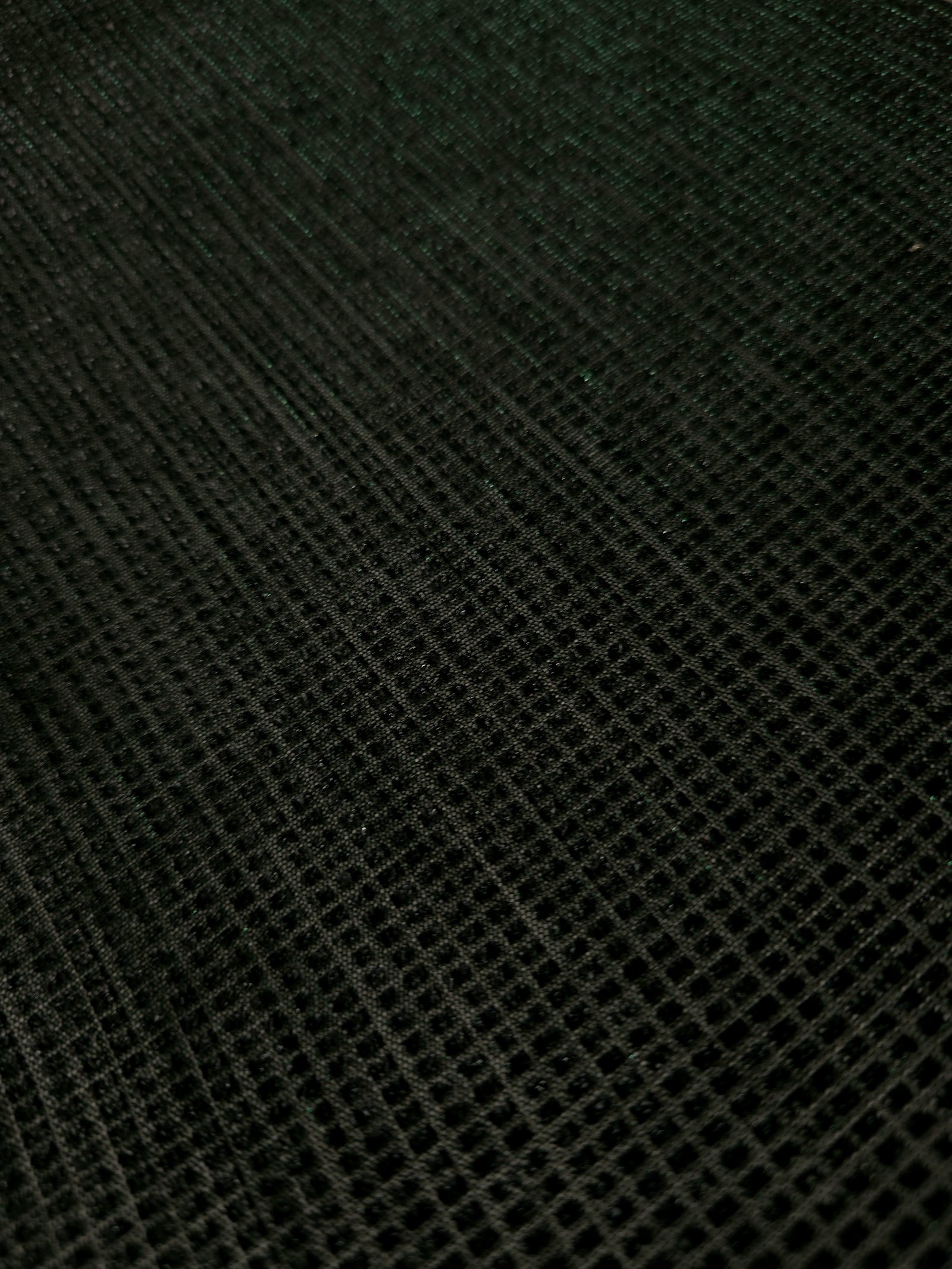 Close-up of Deep Emerald Sheer Square Shimmer Stretch Tulle Fabric revealing the square shimmer repeat and fine transparent mesh