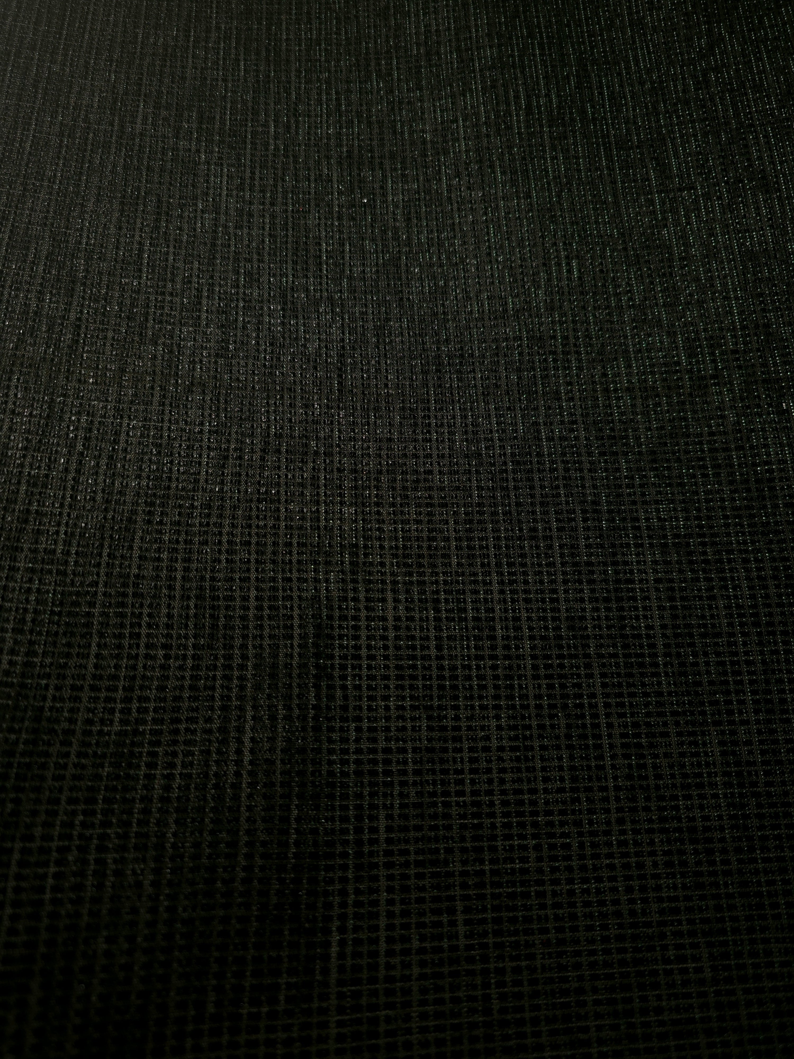 Surface detail of Deep Emerald Sheer Square Shimmer Stretch Tulle Fabric highlighting square grid scale and lightweight tulle texture