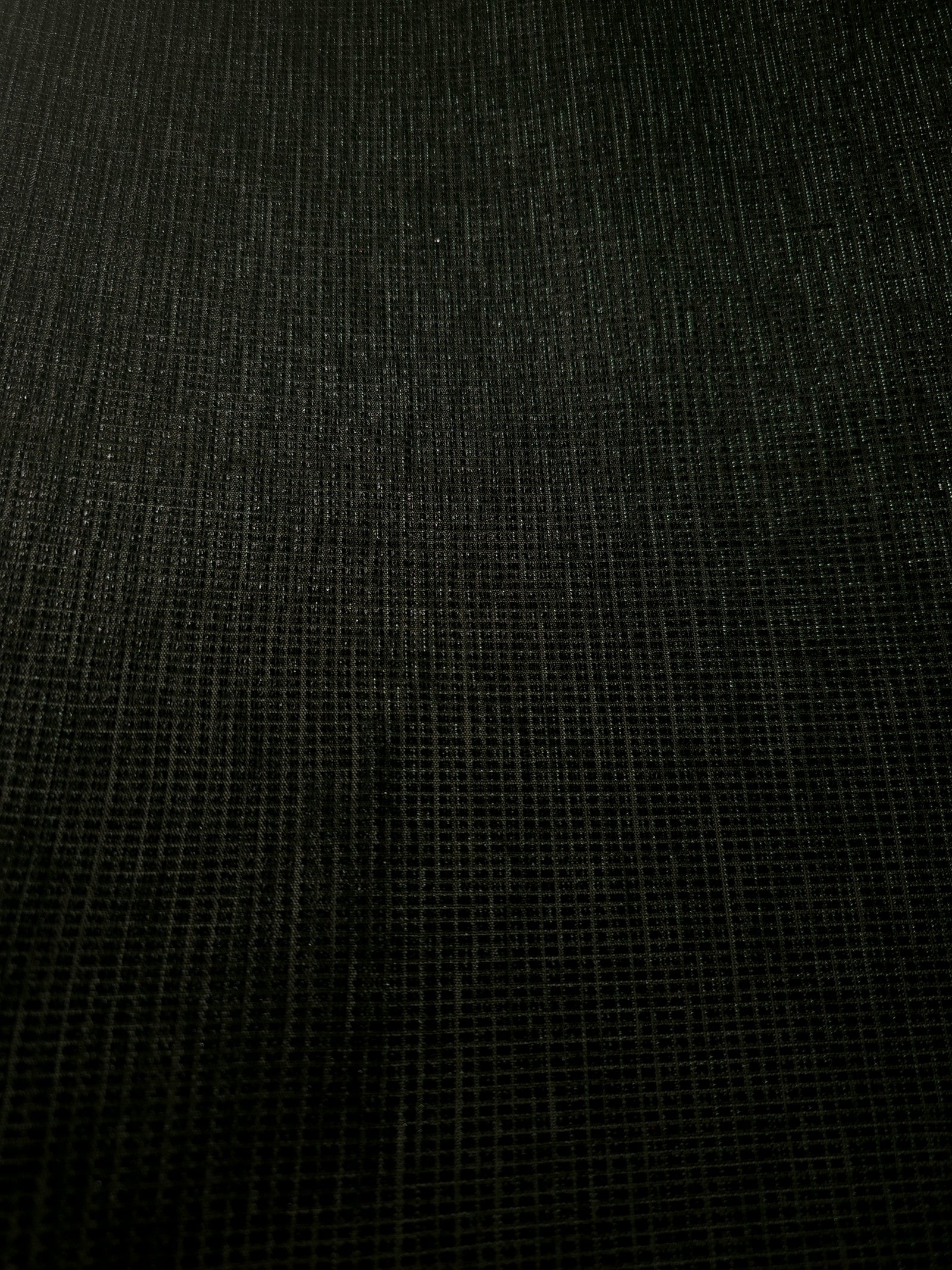 Surface detail of Deep Emerald Sheer Square Shimmer Stretch Tulle Fabric highlighting square grid scale and lightweight tulle texture
