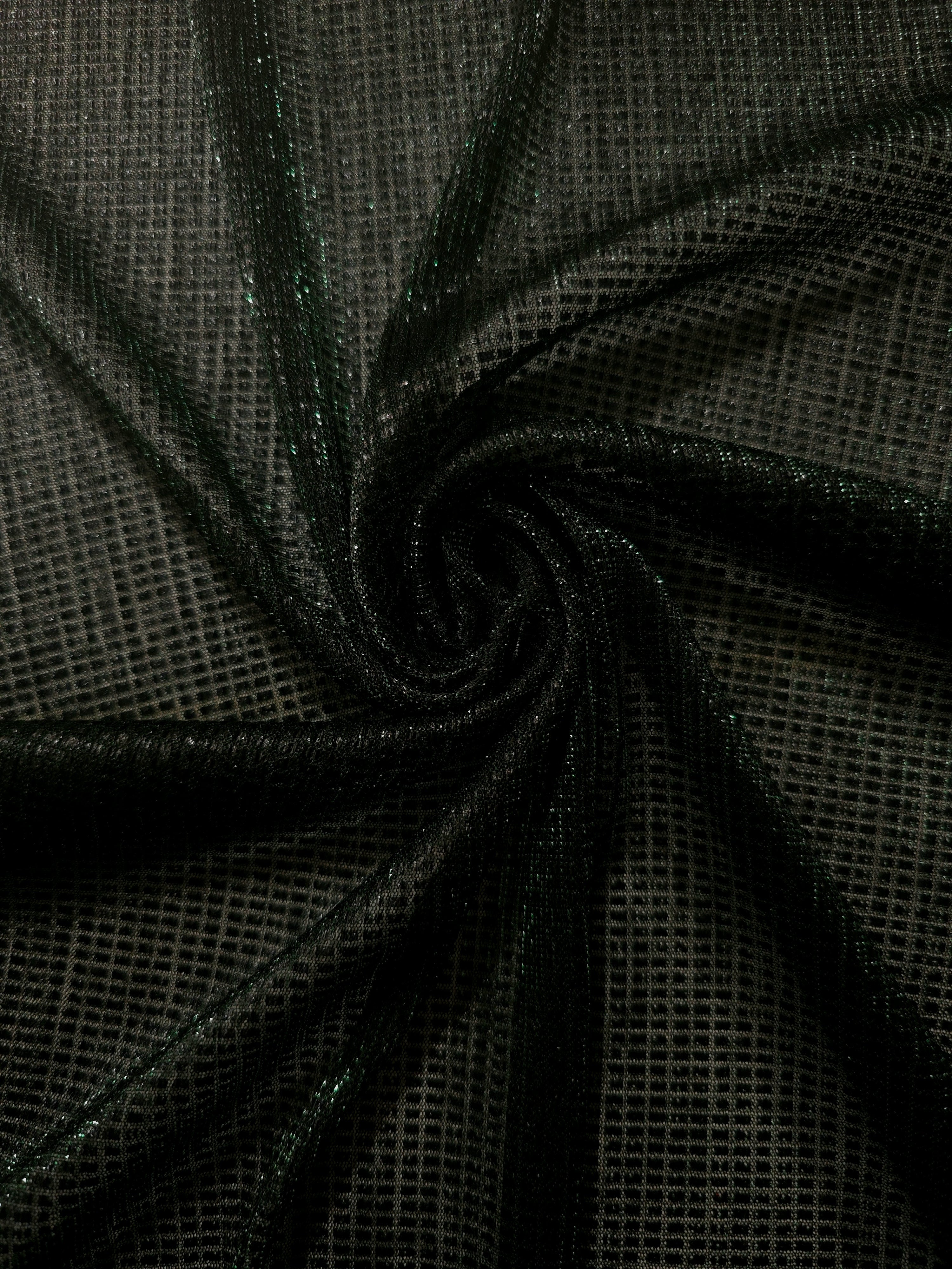 Swirl-draped Deep Emerald Sheer Square Shimmer Stretch Tulle Fabric showing structured square reflections moving through soft folds