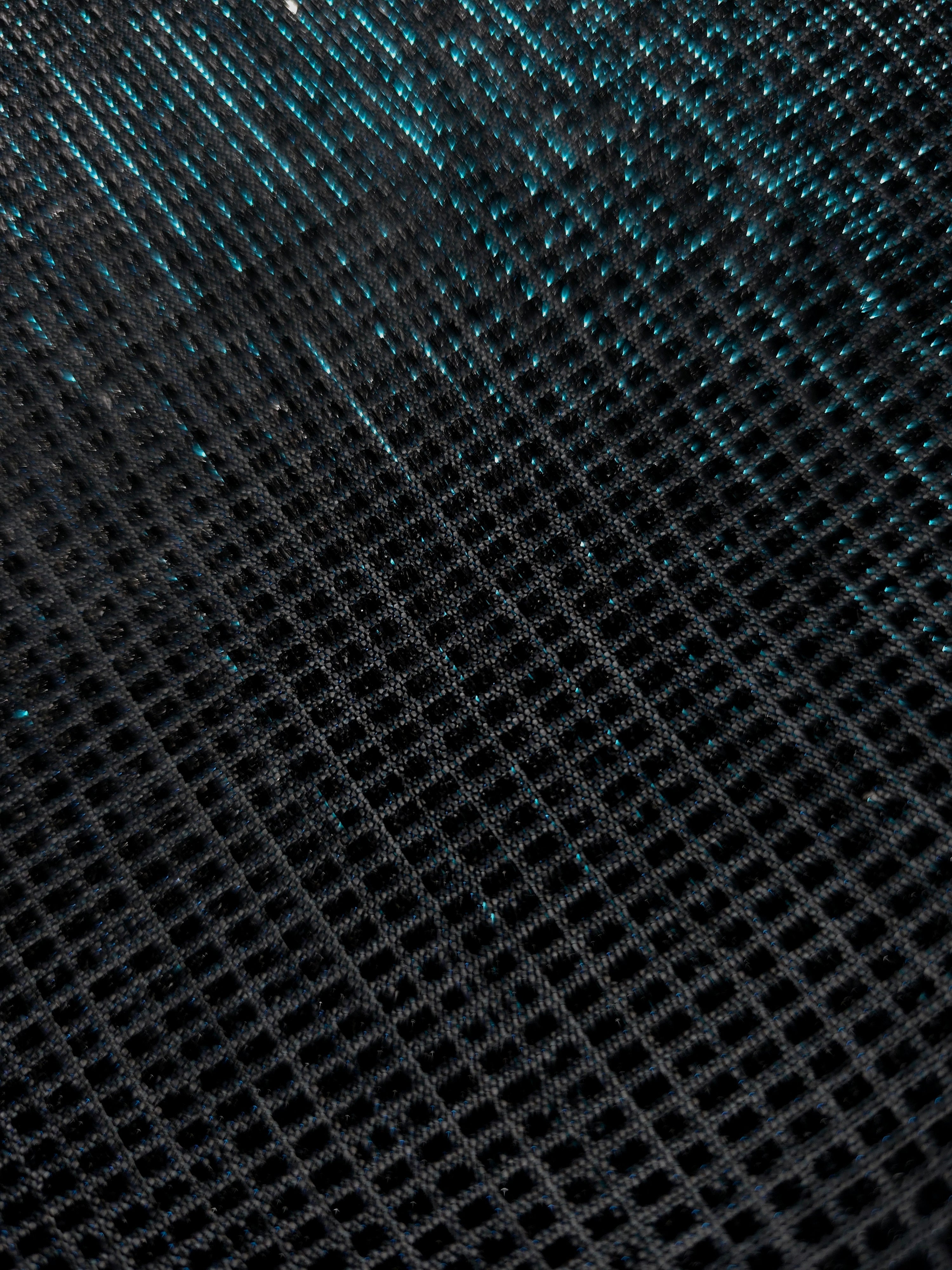 Close-up of Deep Teal Sheer Square Shimmer Stretch Tulle Fabric revealing the square shimmer repeat and fine transparent mesh