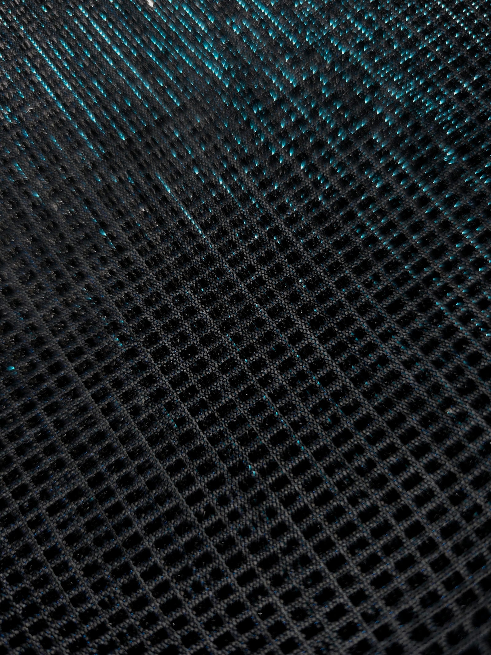 Close-up of Deep Teal Sheer Square Shimmer Stretch Tulle Fabric revealing the square shimmer repeat and fine transparent mesh