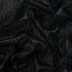 Draped Deep Teal Sheer Square Shimmer Stretch Tulle Fabric showing a geometric reflective grid across fluid folds