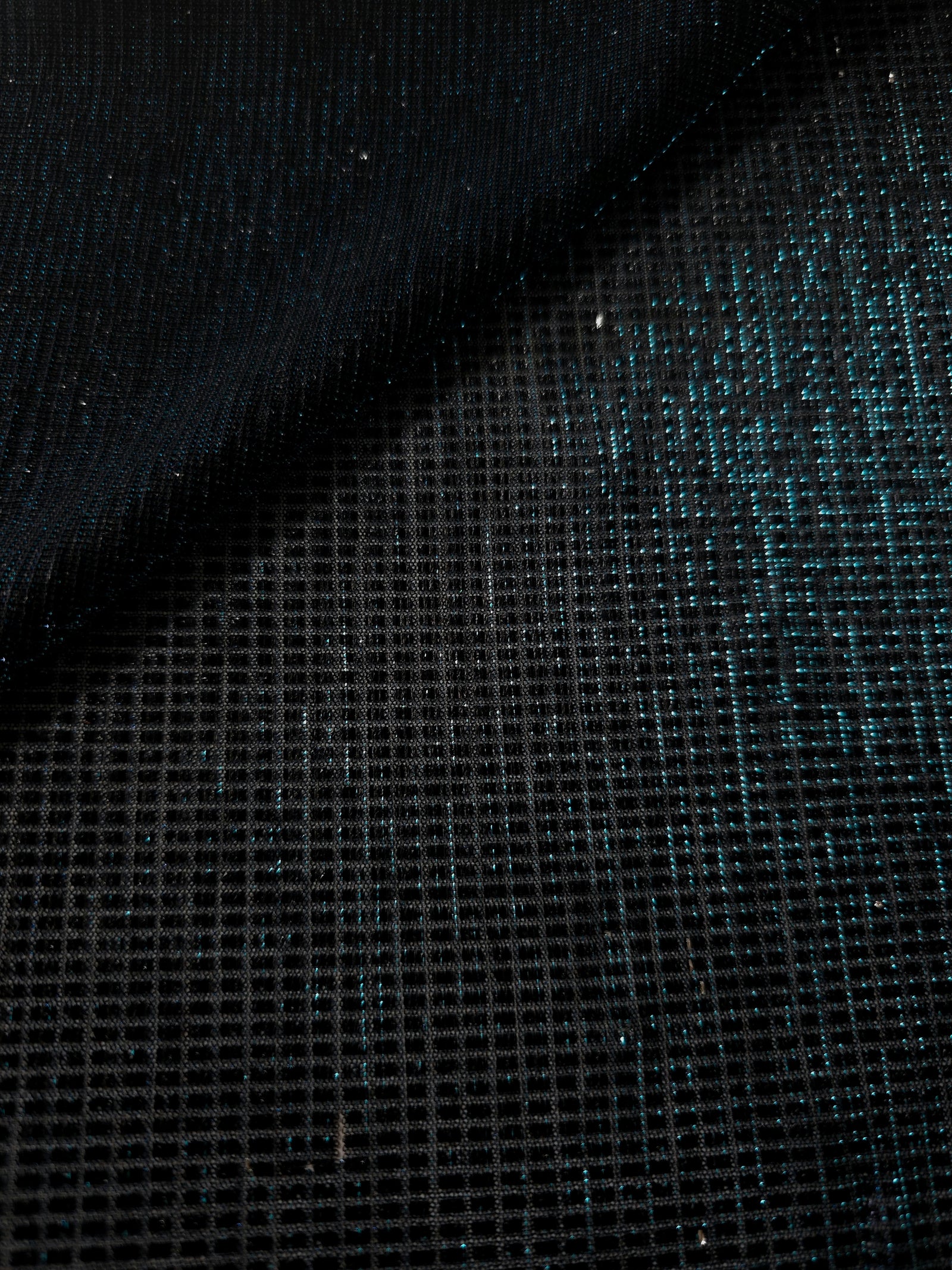 Front and back of Deep Teal Sheer Square Shimmer Stretch Tulle Fabric showing square motif, sheer knit base and flexible stretch