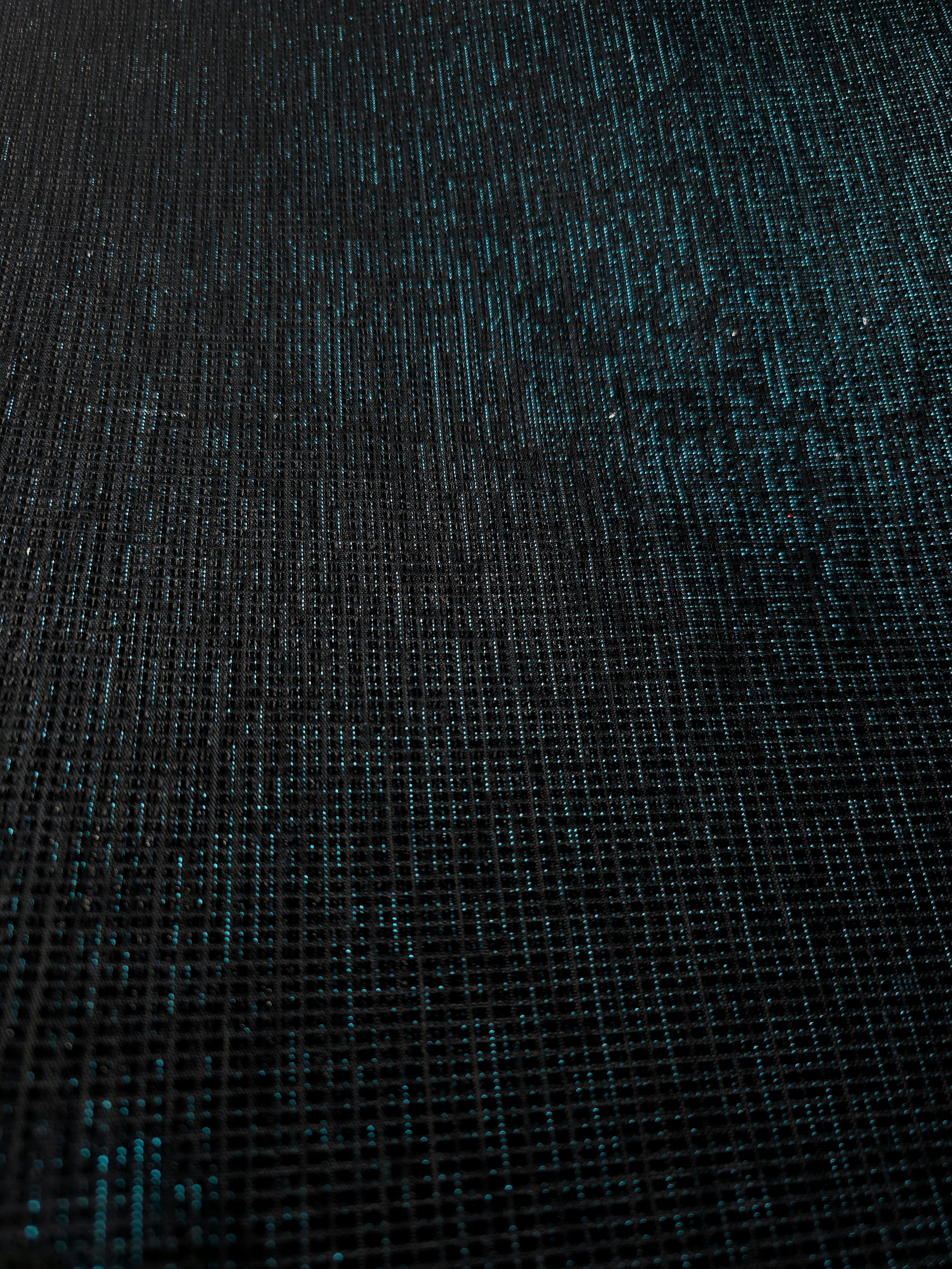 Surface detail of Deep Teal Sheer Square Shimmer Stretch Tulle Fabric highlighting square grid scale and lightweight tulle texture