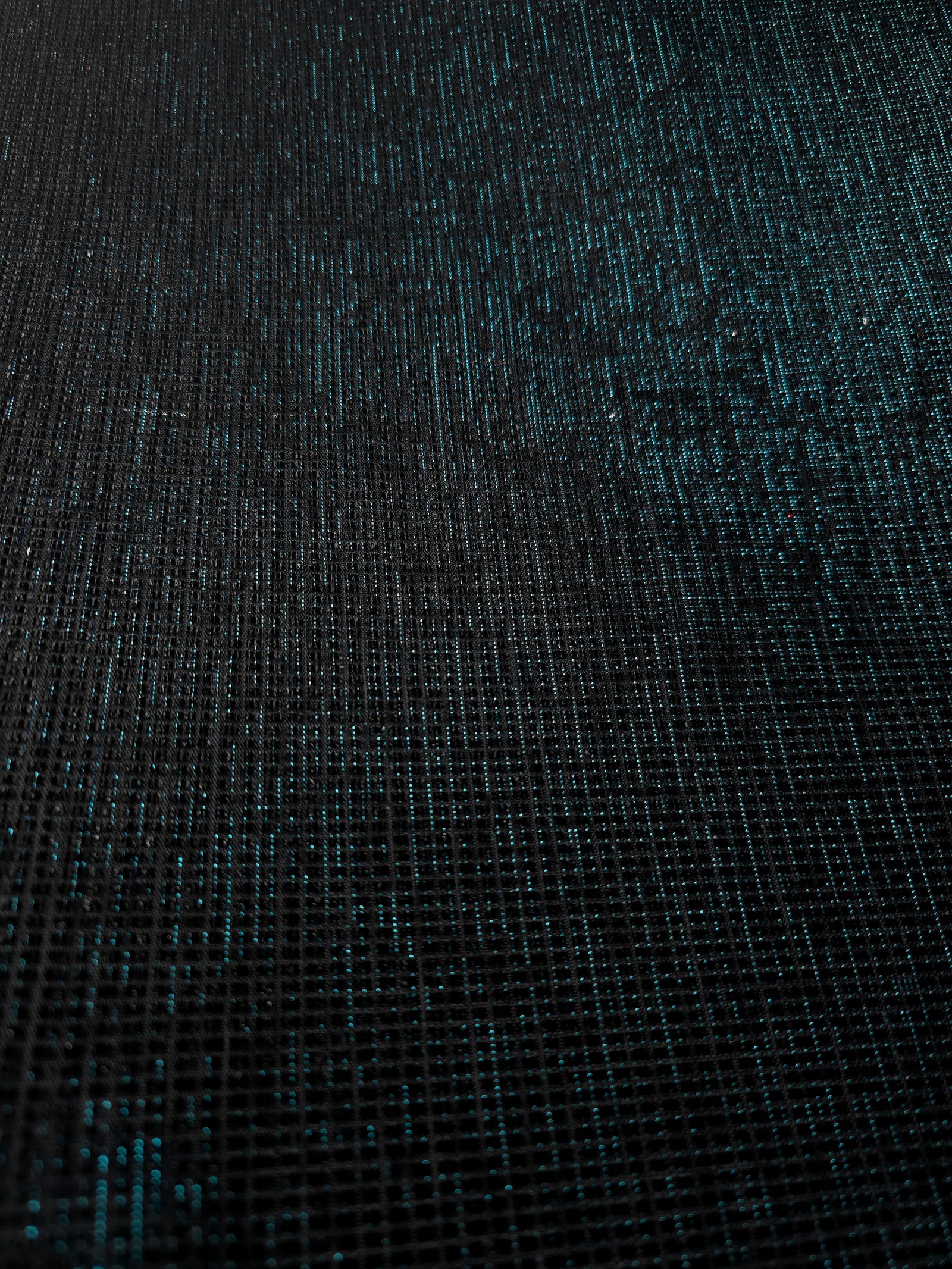 Surface detail of Deep Teal Sheer Square Shimmer Stretch Tulle Fabric highlighting square grid scale and lightweight tulle texture