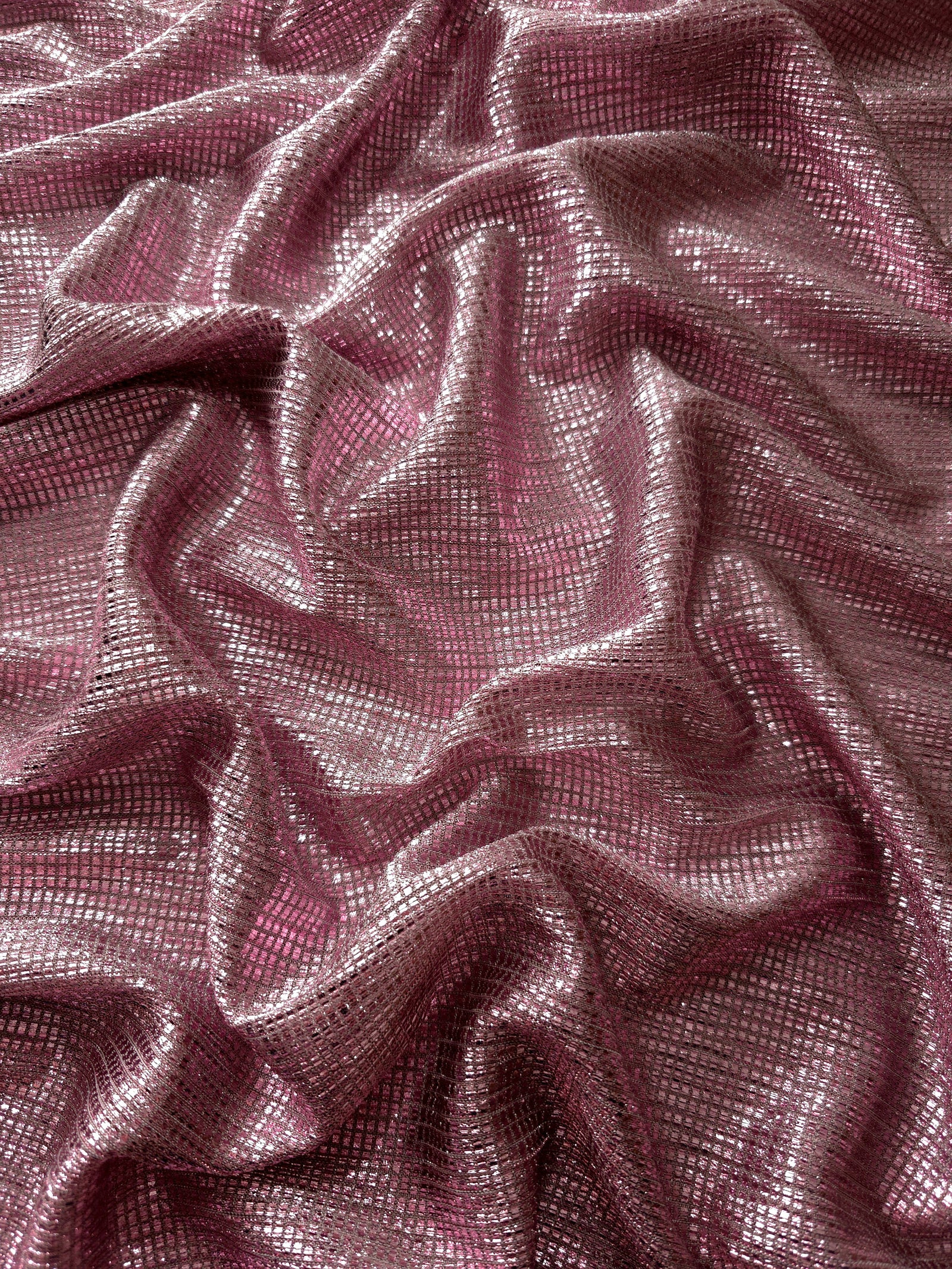 Draped Dusty Mauve Sheer Square Shimmer Stretch Tulle Fabric showing a geometric reflective grid across fluid folds