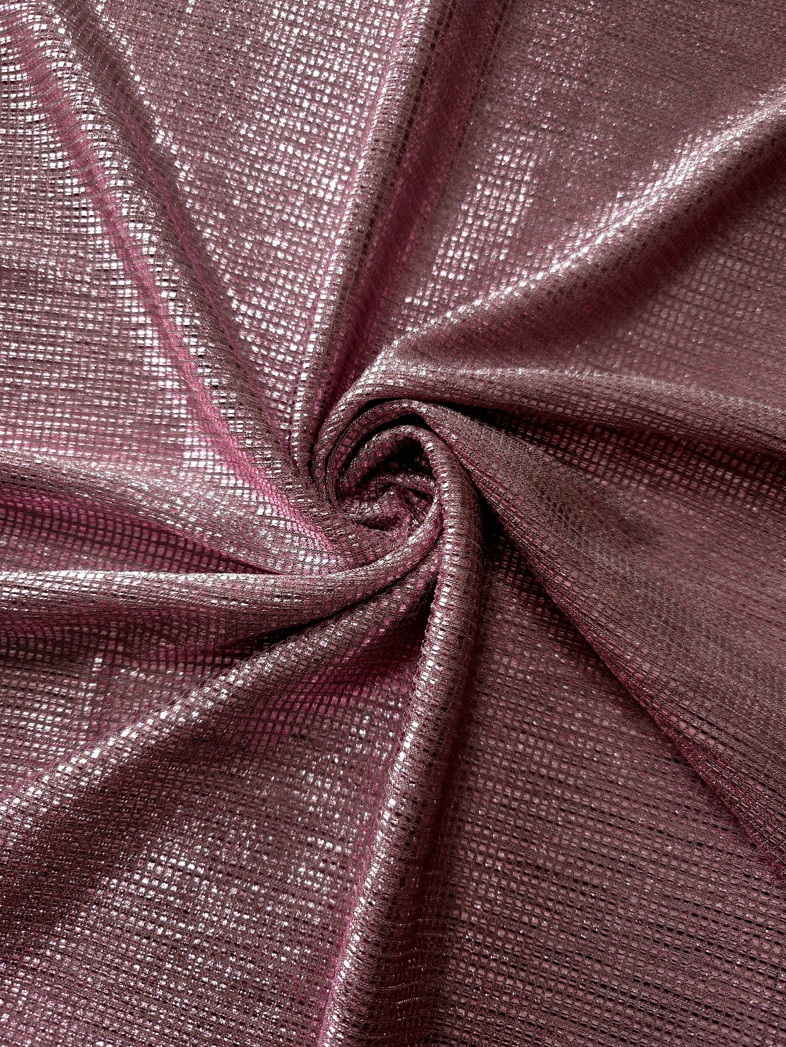 Swirl-draped Dusty Mauve Sheer Square Shimmer Stretch Tulle Fabric showing structured square reflections moving through soft folds