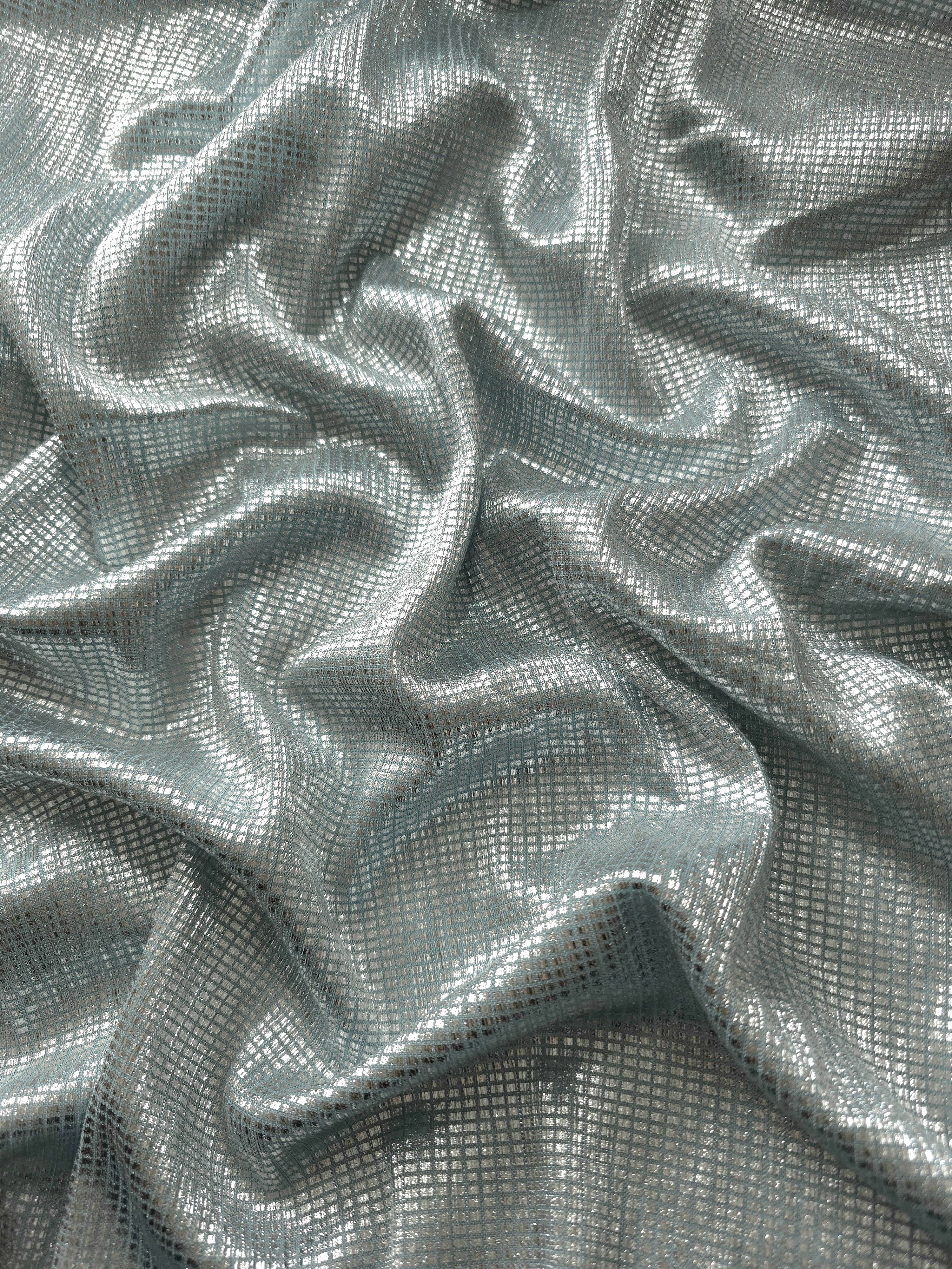 Draped Icy Silver Sheer Square Shimmer Stretch Tulle Fabric showing a geometric reflective grid across fluid folds