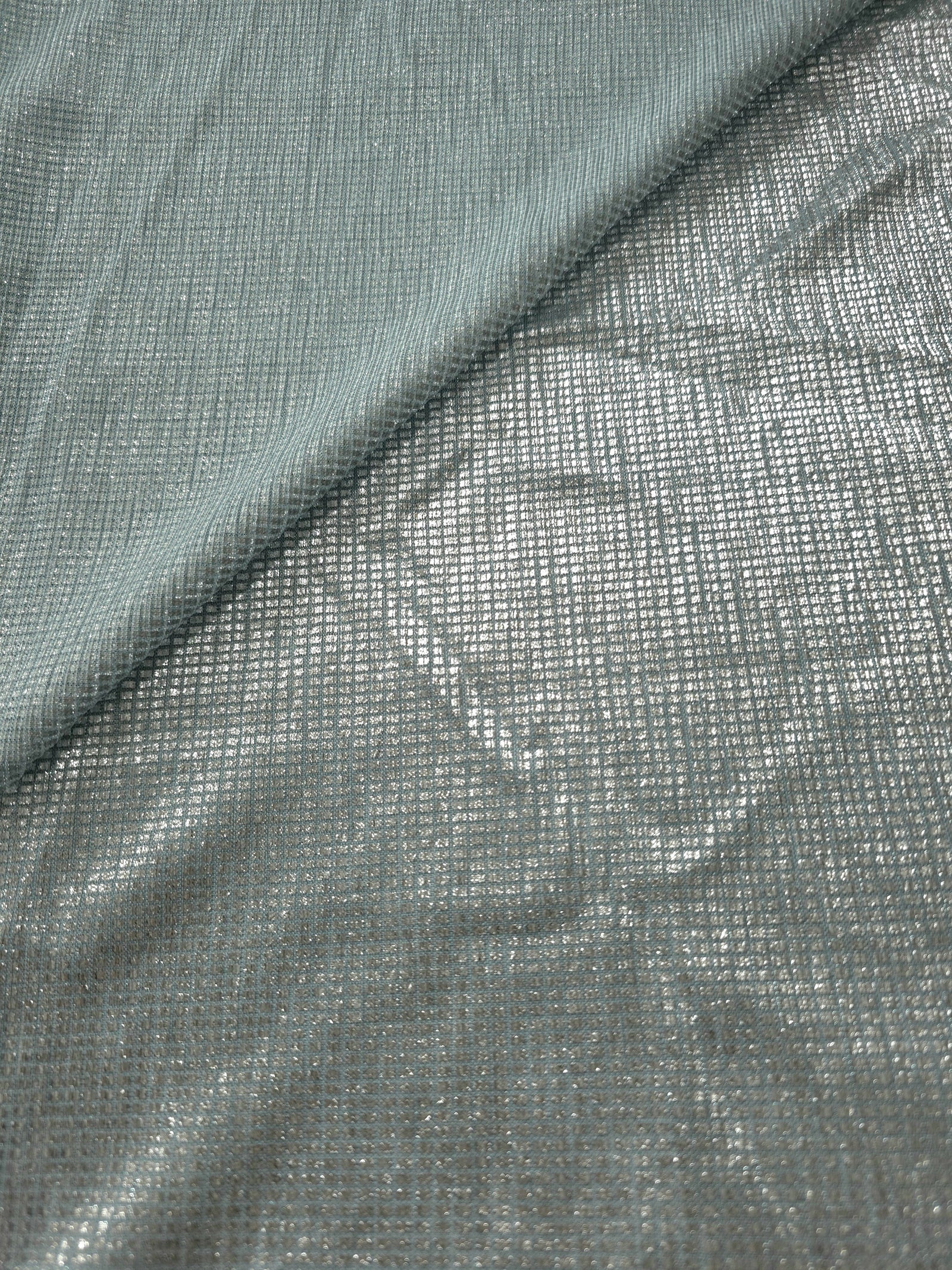 Front and back of Icy Silver Sheer Square Shimmer Stretch Tulle Fabric showing square motif, sheer knit base and flexible stretch