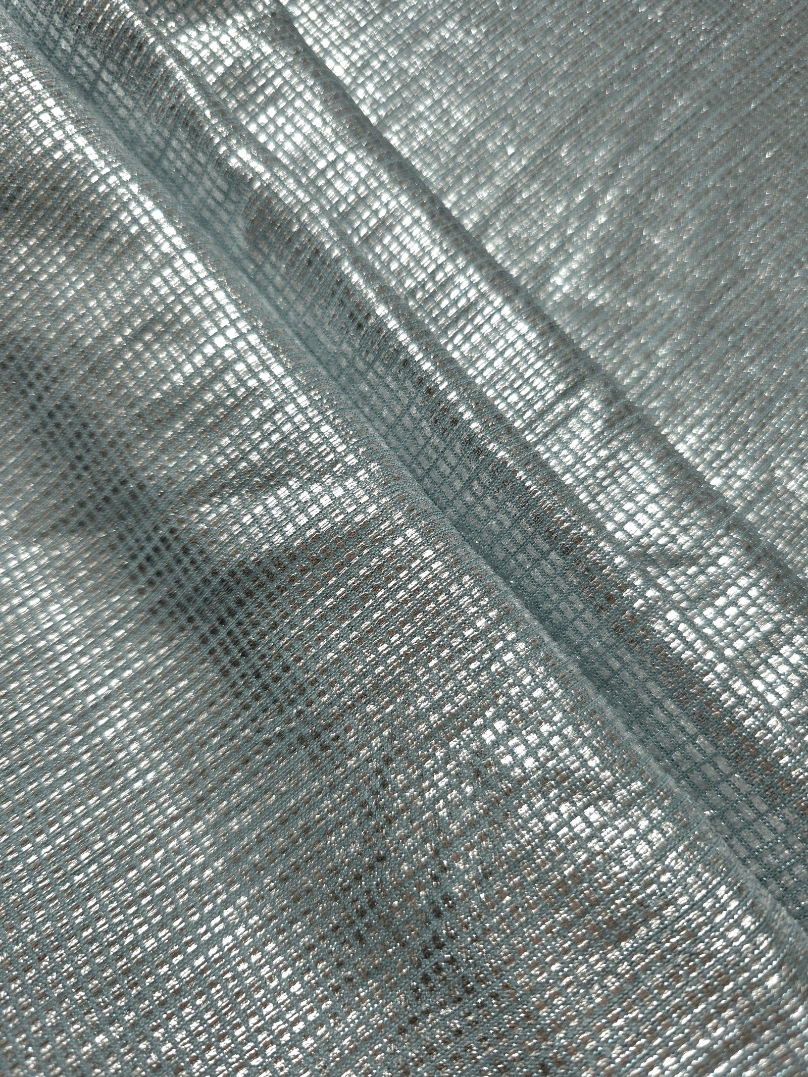 Layered Icy Silver Sheer Square Shimmer Stretch Tulle Fabric showing overlapping geometry, denser shimmer and translucent depth
