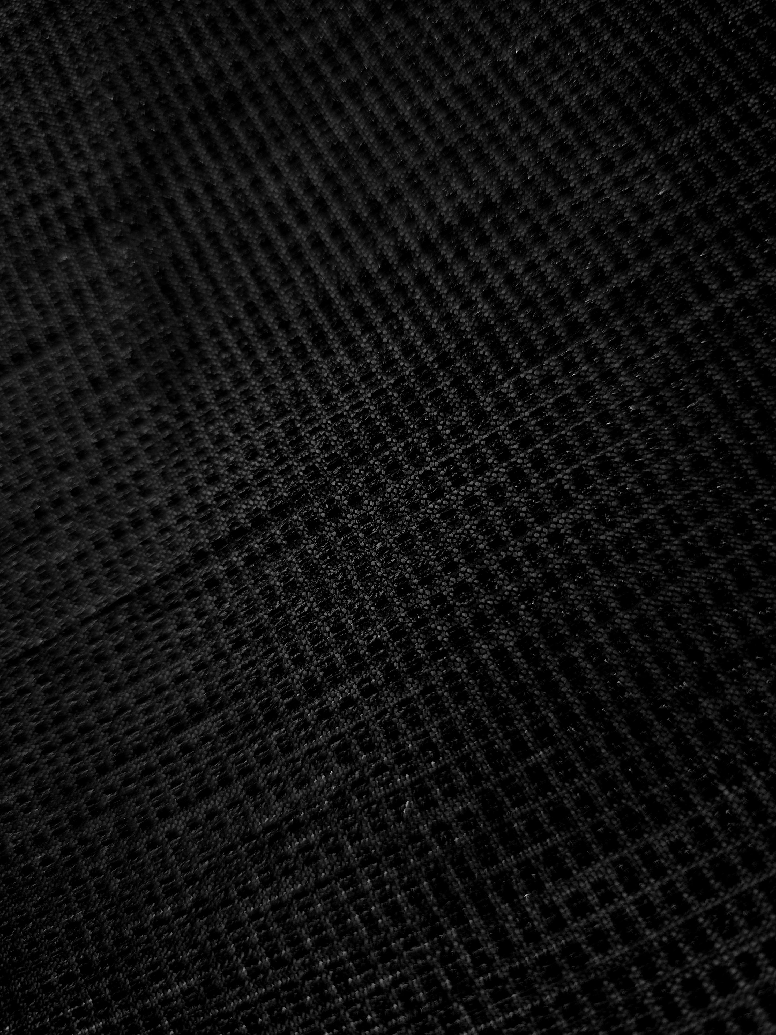 Close-up of Jet Black Sheer Square Shimmer Stretch Tulle Fabric revealing the square shimmer repeat and fine transparent mesh