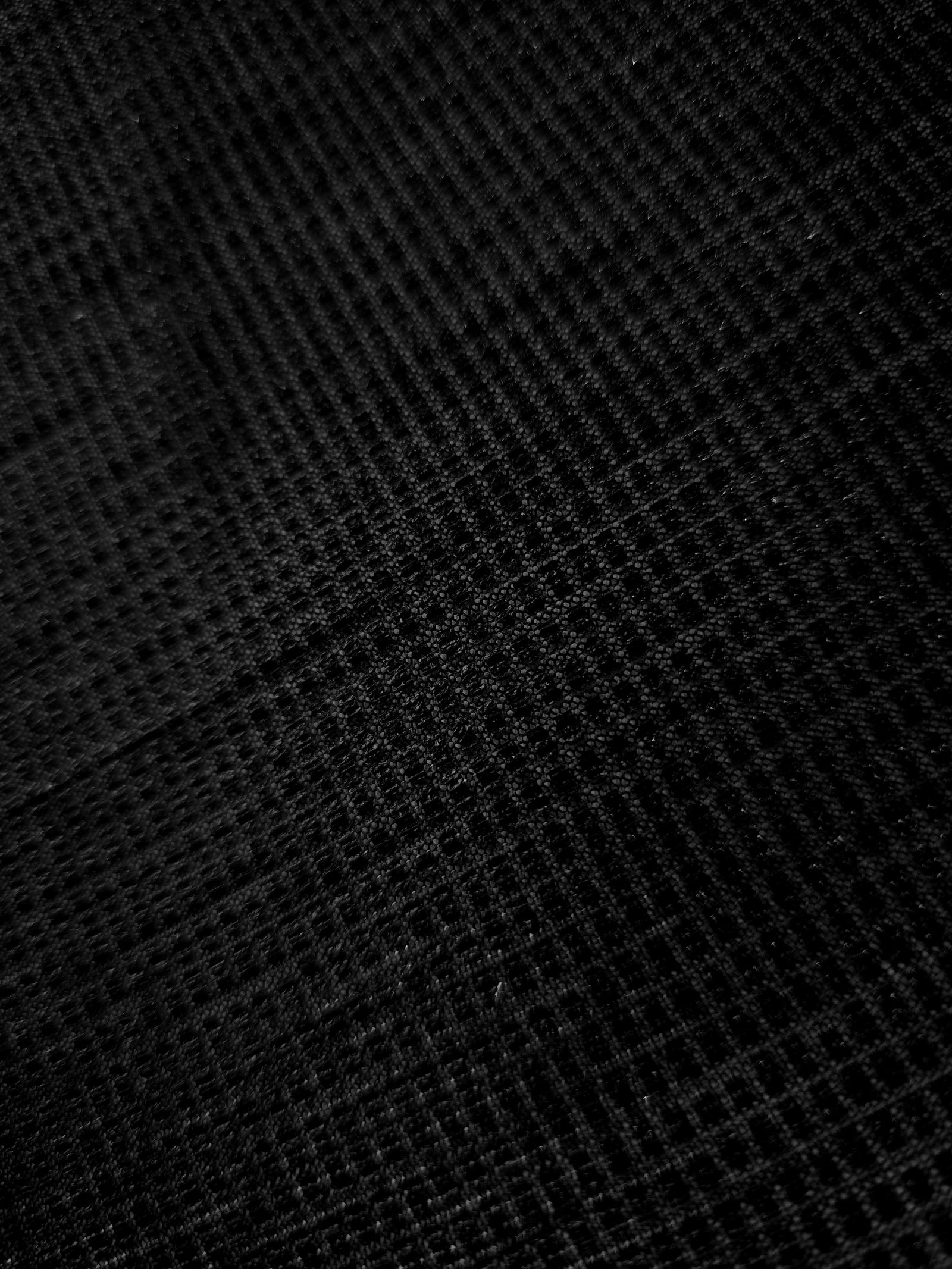 Close-up of Jet Black Sheer Square Shimmer Stretch Tulle Fabric revealing the square shimmer repeat and fine transparent mesh