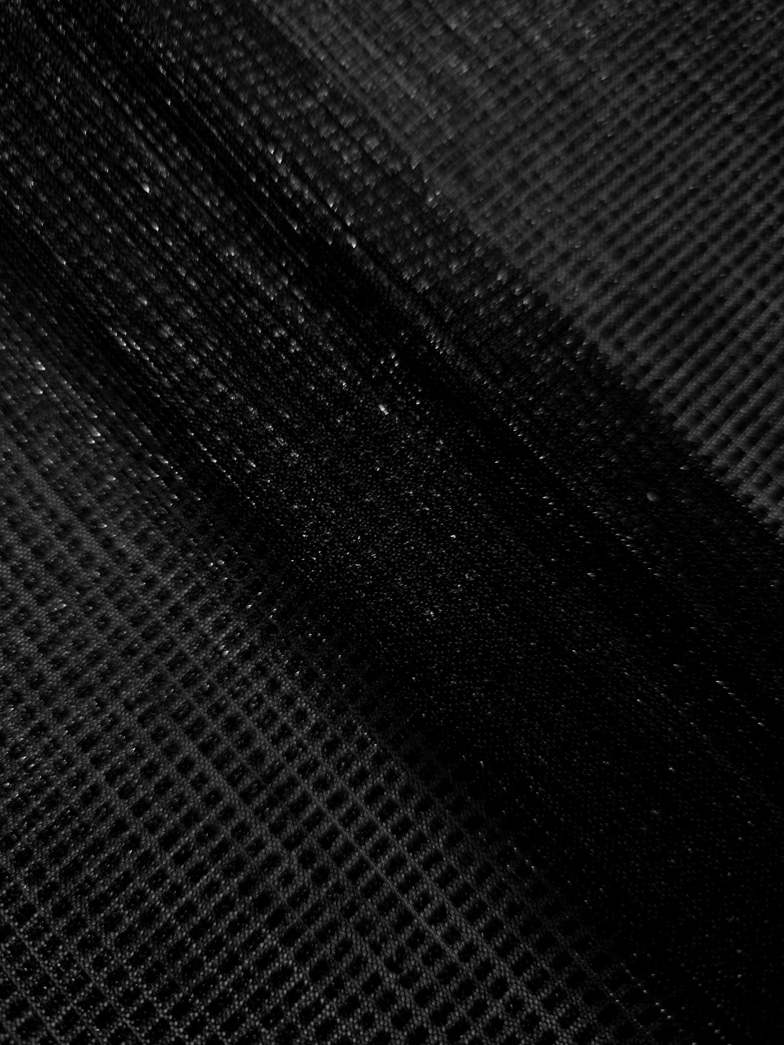 Layered Jet Black Sheer Square Shimmer Stretch Tulle Fabric showing overlapping geometry, denser shimmer and translucent depth