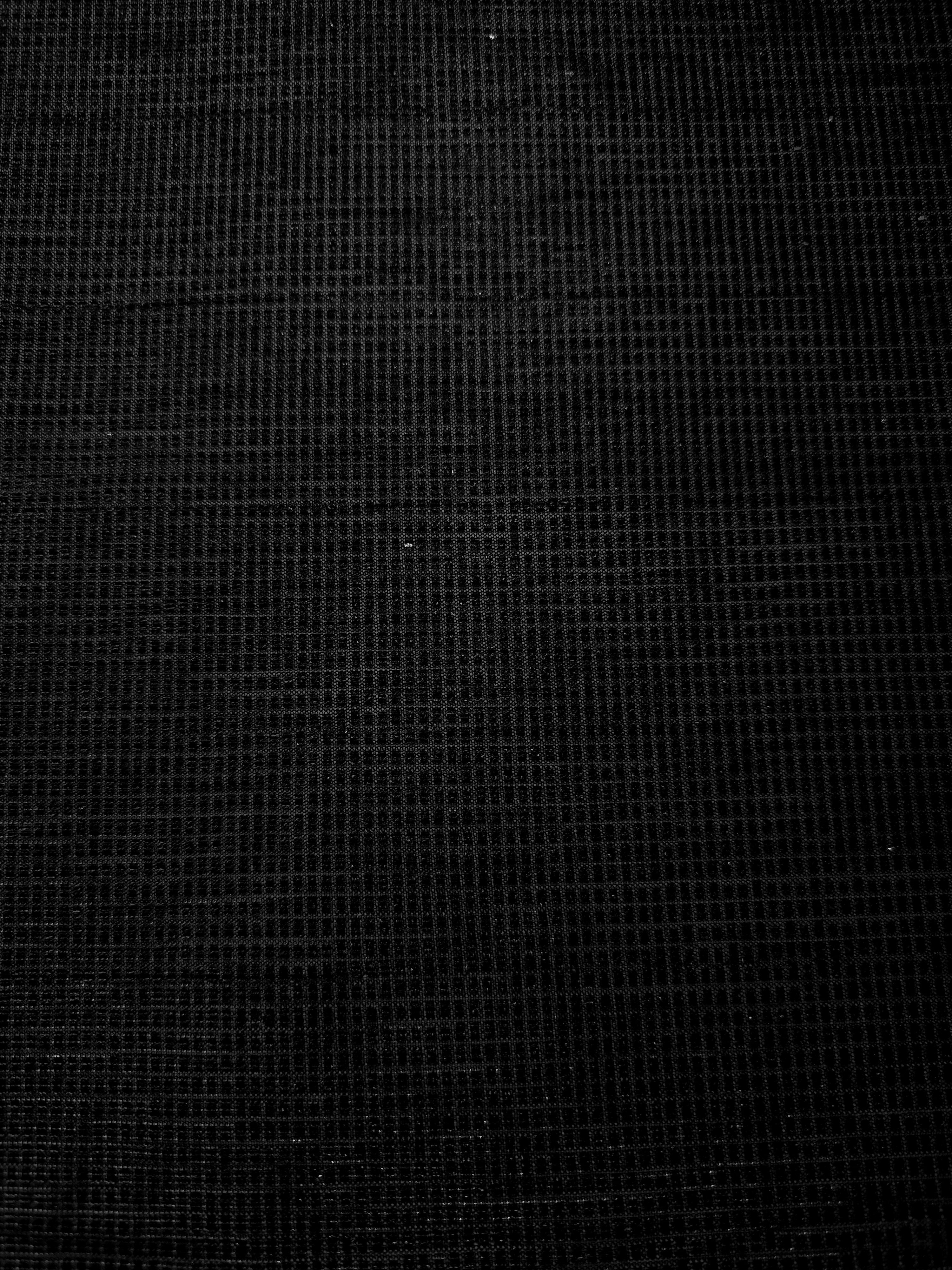 Surface detail of Jet Black Sheer Square Shimmer Stretch Tulle Fabric highlighting square grid scale and lightweight tulle texture