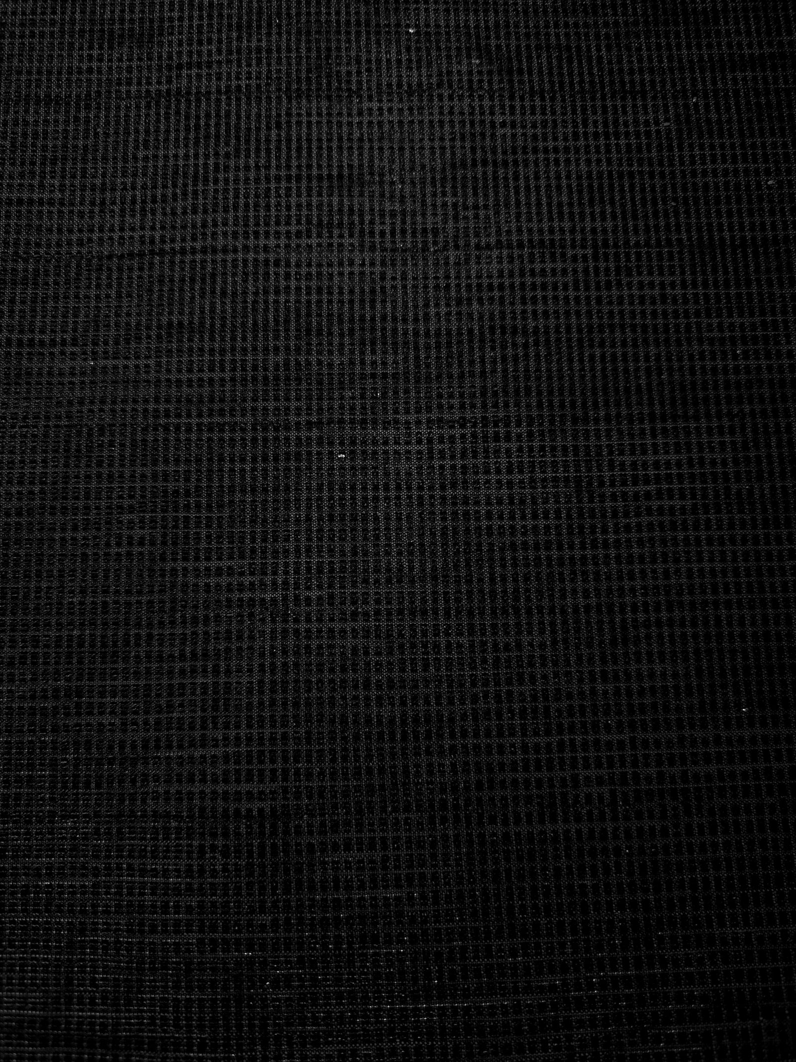 Surface detail of Jet Black Sheer Square Shimmer Stretch Tulle Fabric highlighting square grid scale and lightweight tulle texture