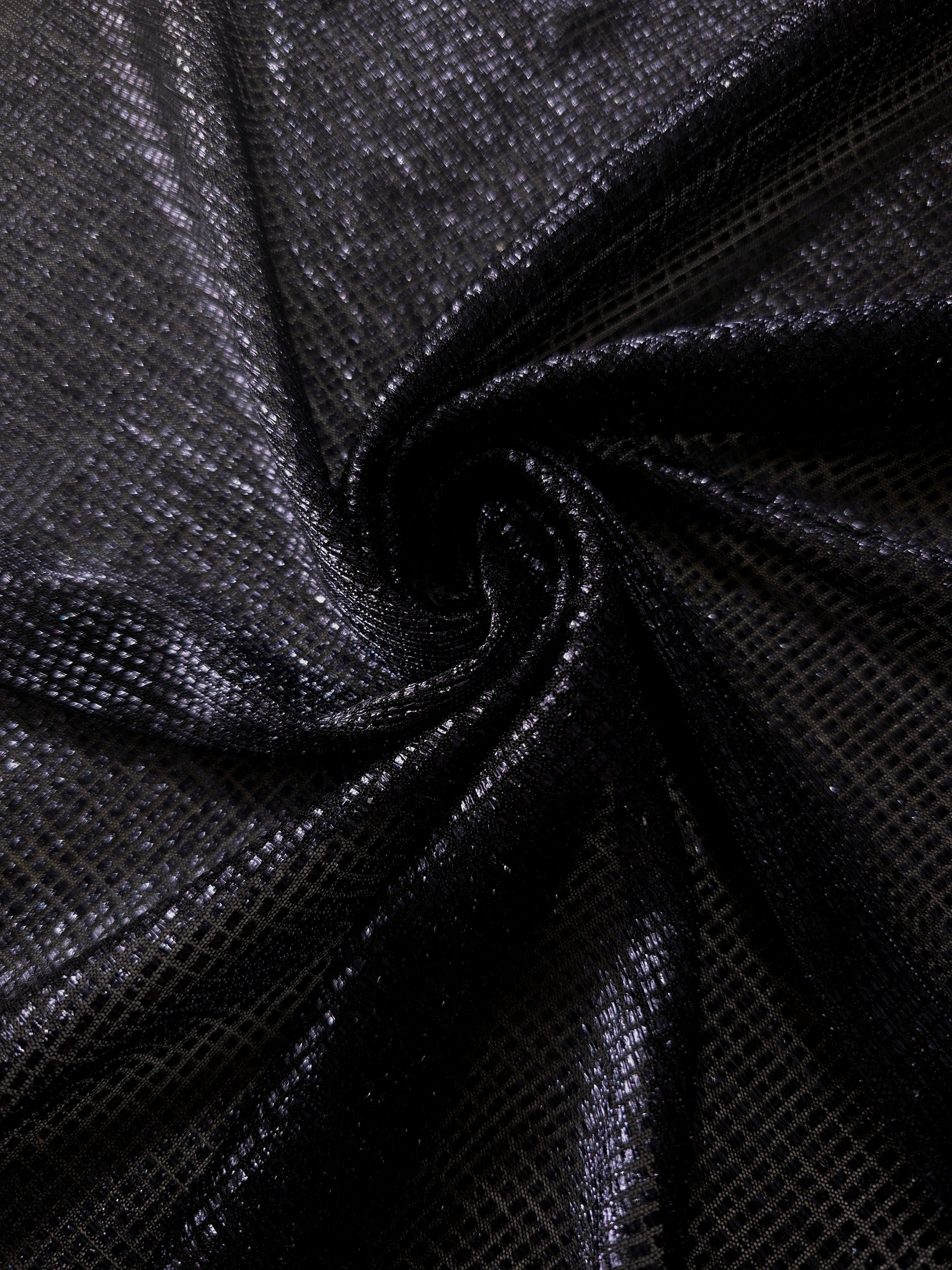 Swirl-draped Midnight Indigo Sheer Square Shimmer Stretch Tulle Fabric showing structured square reflections moving through soft folds