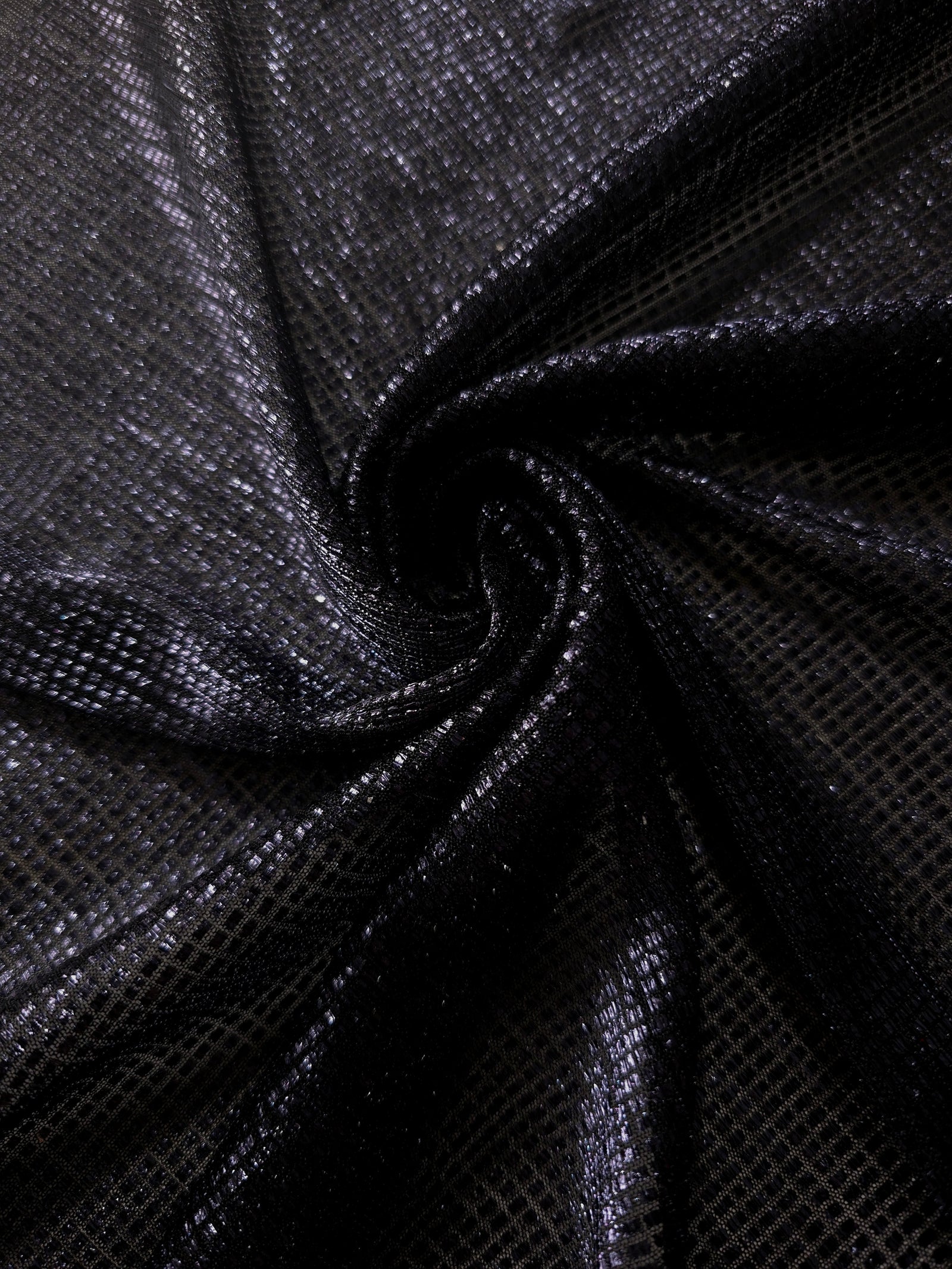 Swirl-draped Midnight Indigo Sheer Square Shimmer Stretch Tulle Fabric showing structured square reflections moving through soft folds