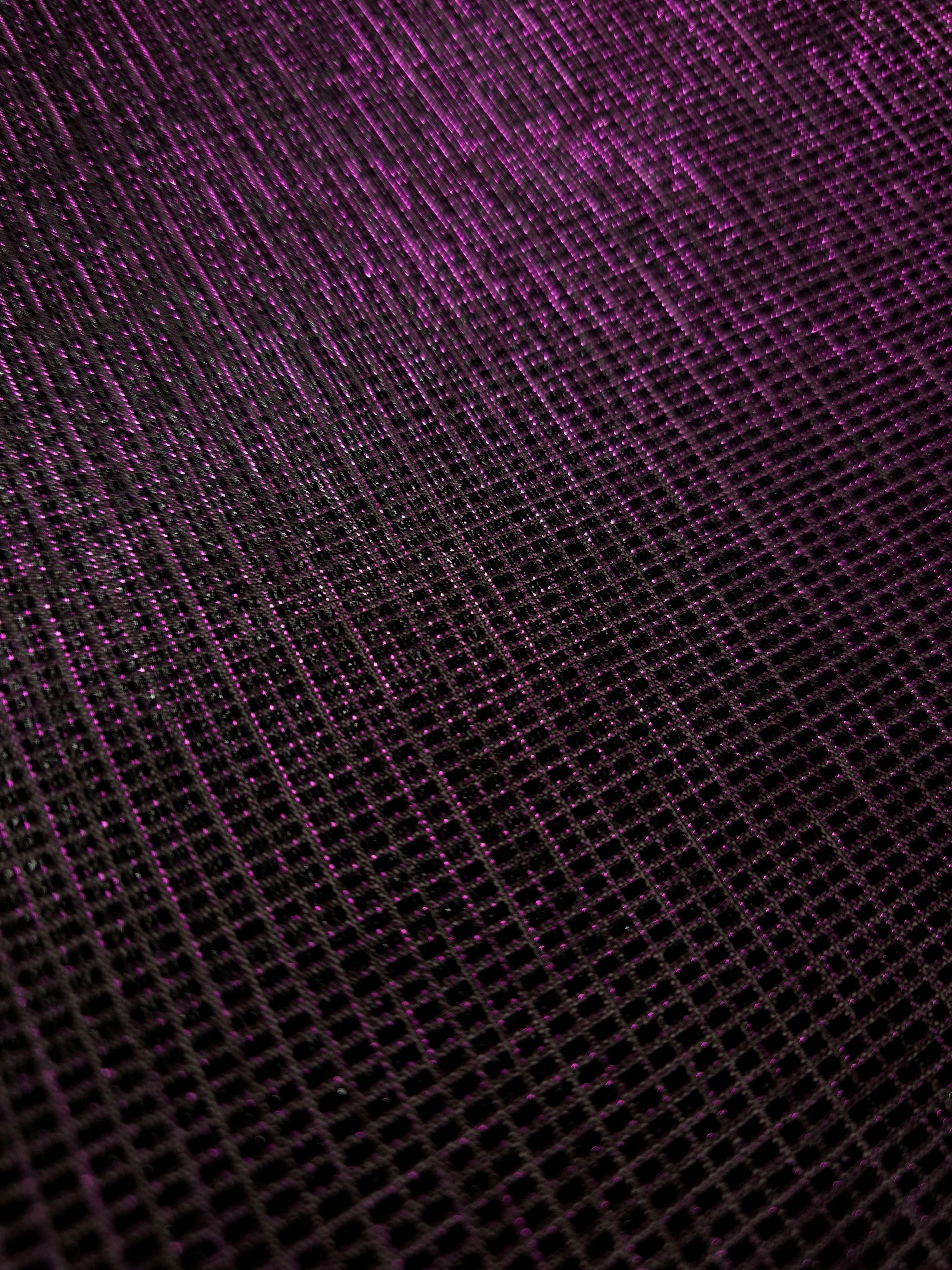 Close-up of Plum Violet Sheer Square Shimmer Stretch Tulle Fabric revealing the square shimmer repeat and fine transparent mesh