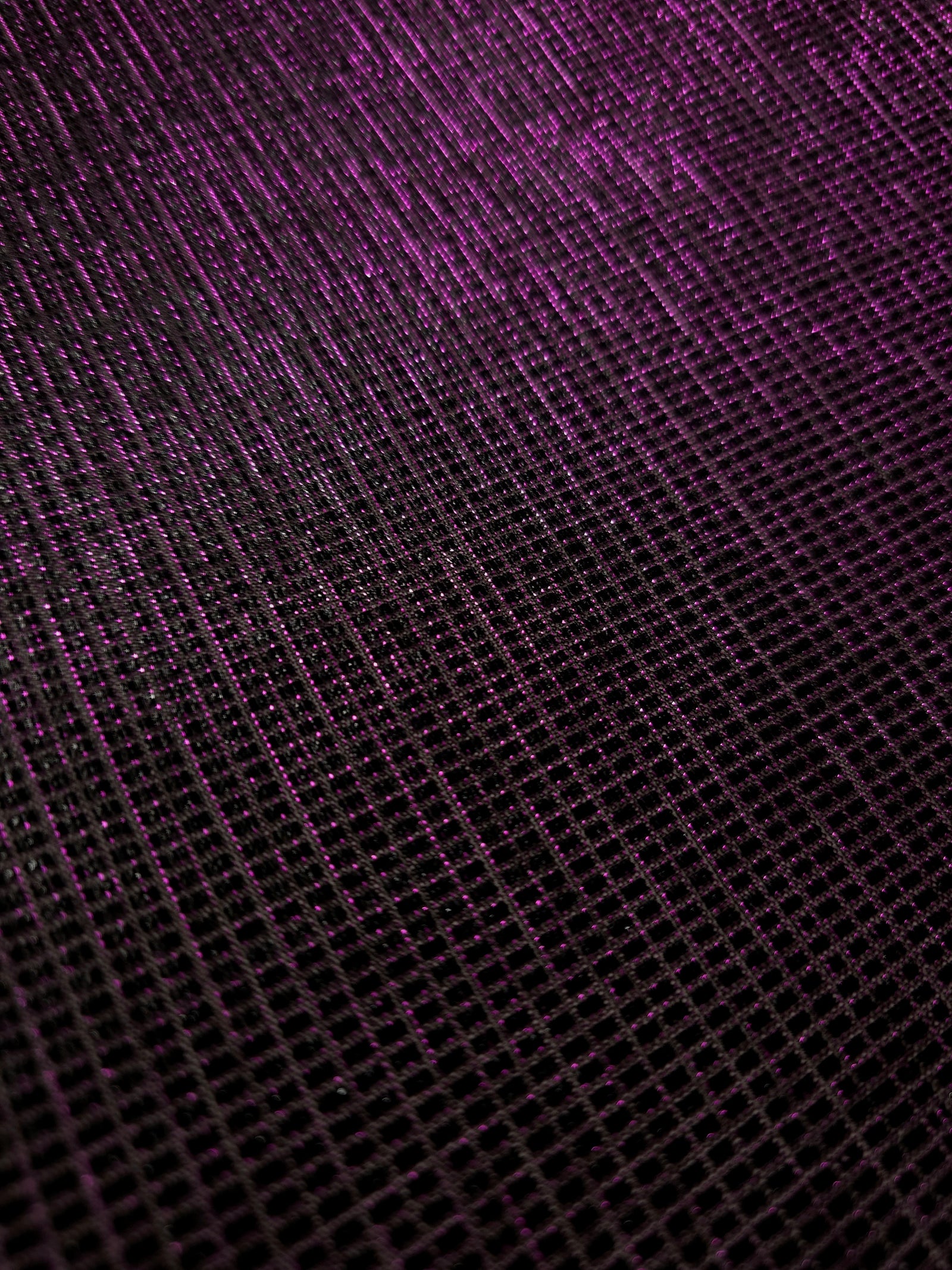 Close-up of Plum Violet Sheer Square Shimmer Stretch Tulle Fabric revealing the square shimmer repeat and fine transparent mesh