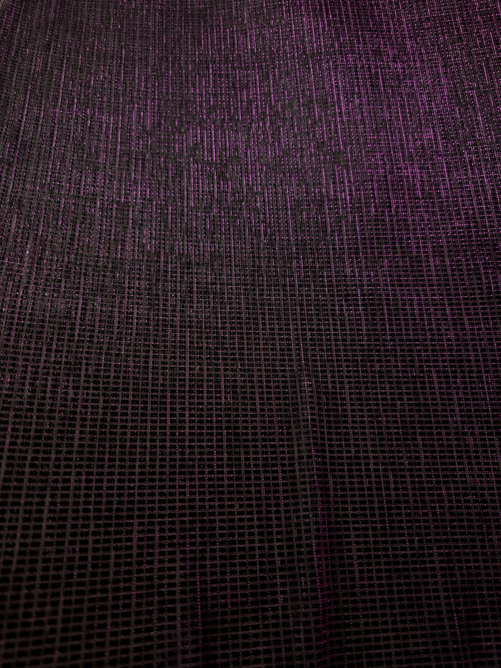 Surface detail of Plum Violet Sheer Square Shimmer Stretch Tulle Fabric highlighting square grid scale and lightweight tulle texture