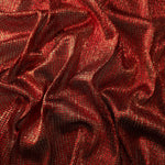 Draped Ruby Red Sheer Square Shimmer Stretch Tulle Fabric showing a geometric reflective grid across fluid folds