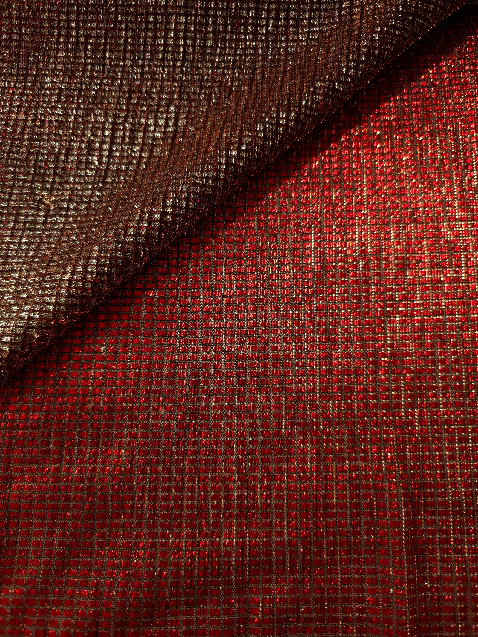 Front and back of Ruby Red Sheer Square Shimmer Stretch Tulle Fabric showing square motif, sheer knit base and flexible stretch