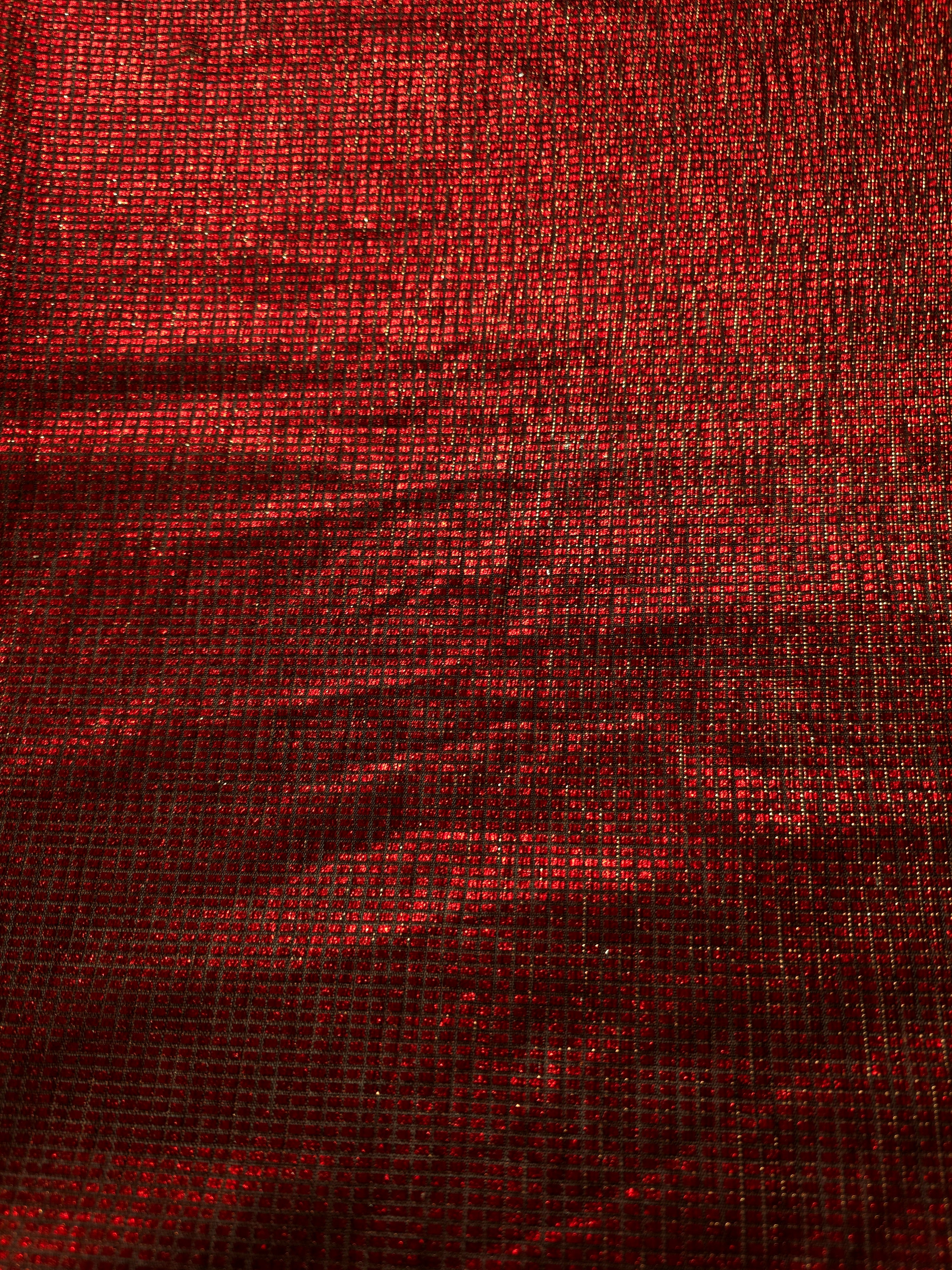 Surface detail of Ruby Red Sheer Square Shimmer Stretch Tulle Fabric highlighting square grid scale and lightweight tulle texture