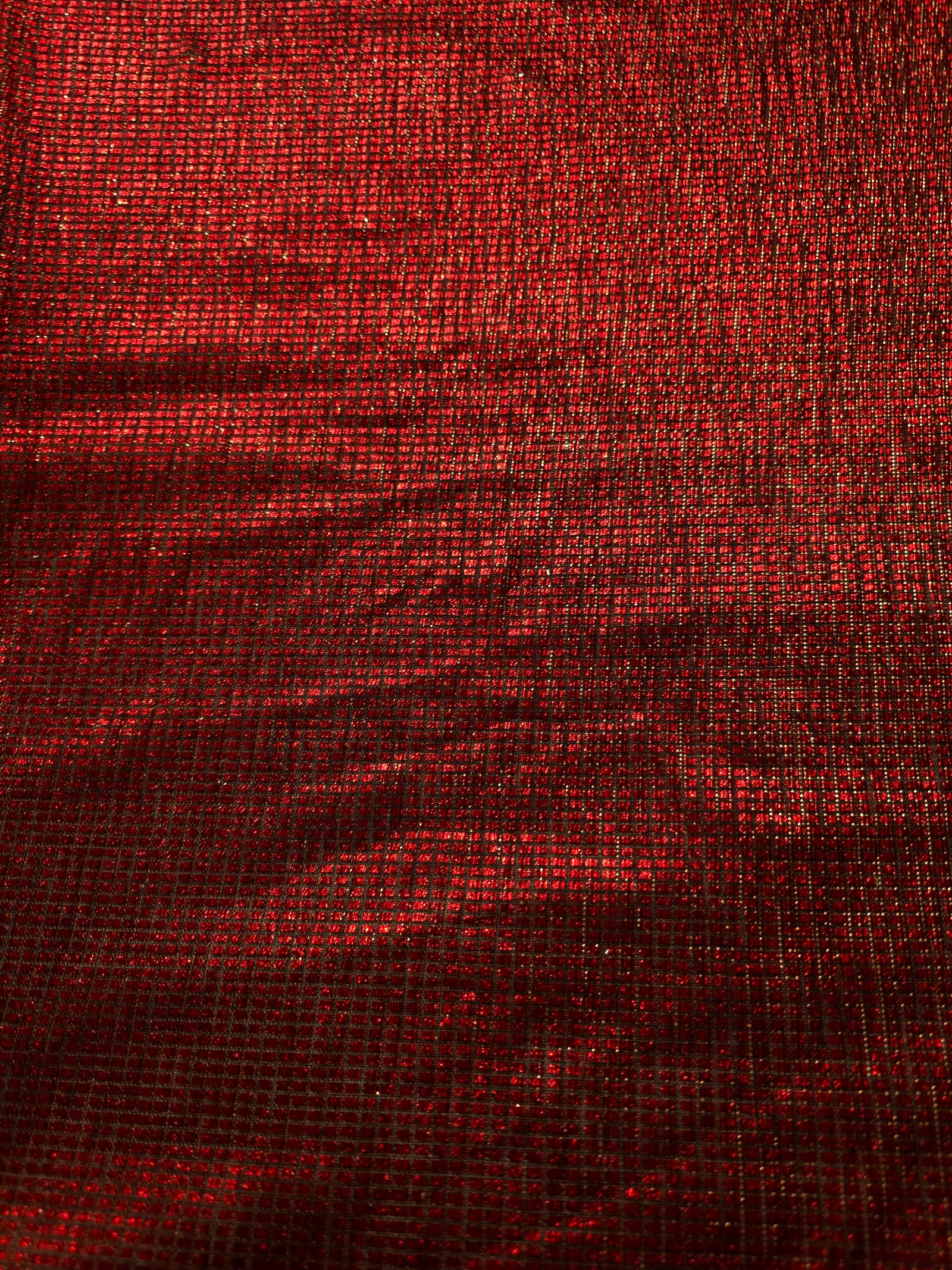 Surface detail of Ruby Red Sheer Square Shimmer Stretch Tulle Fabric highlighting square grid scale and lightweight tulle texture