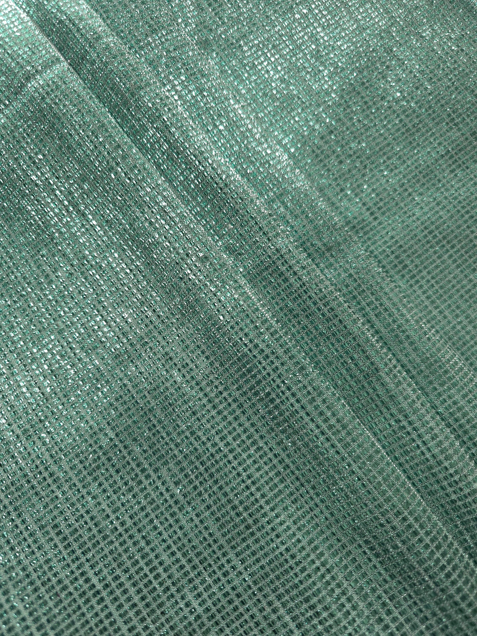 Layered Sage Green Sheer Square Shimmer Stretch Tulle Fabric showing overlapping geometry, denser shimmer and translucent depth