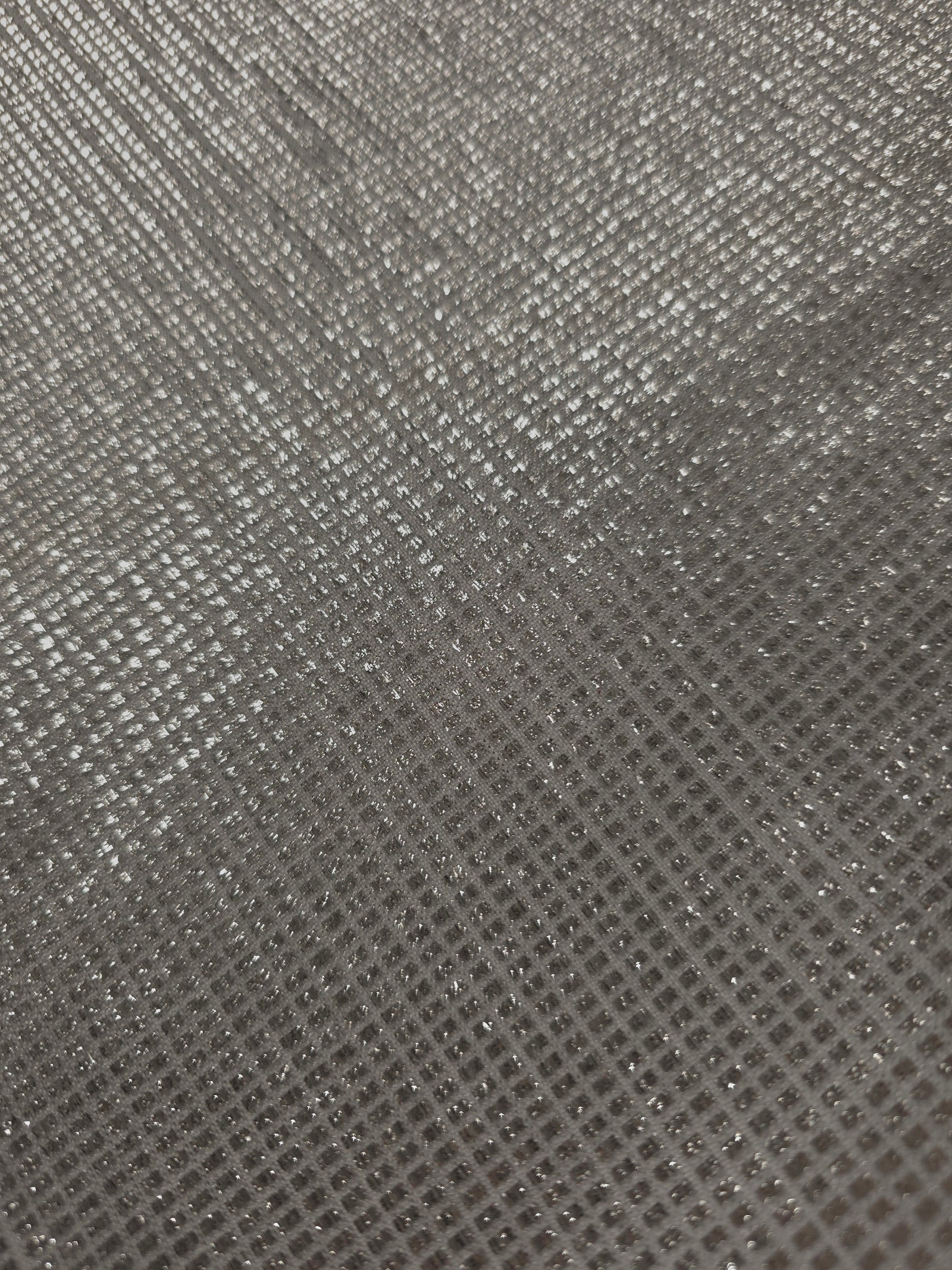 Close-up of Silver Gray Sheer Square Shimmer Stretch Tulle Fabric revealing the square shimmer repeat and fine transparent mesh