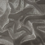 Draped Silver Gray Sheer Square Shimmer Stretch Tulle Fabric showing a geometric reflective grid across fluid folds