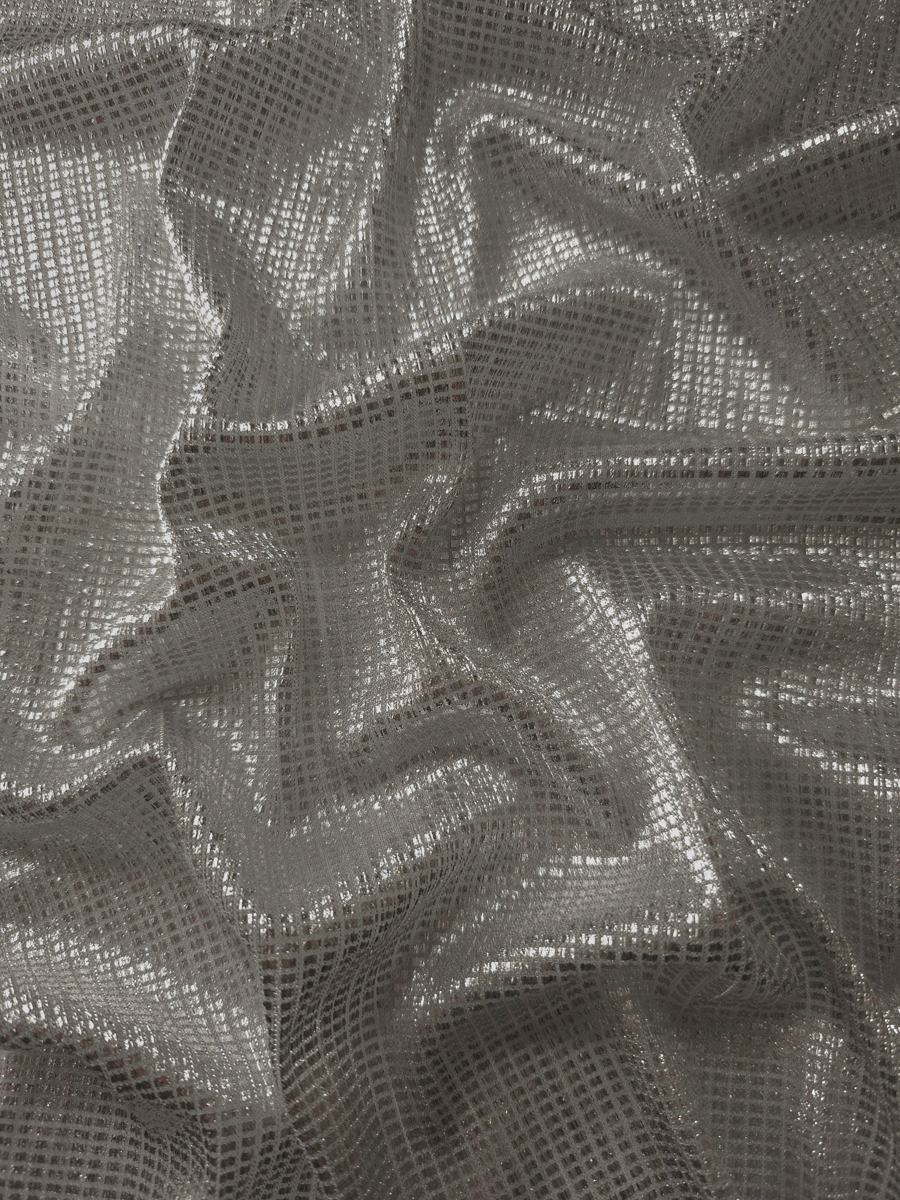 Draped Silver Gray Sheer Square Shimmer Stretch Tulle Fabric showing a geometric reflective grid across fluid folds