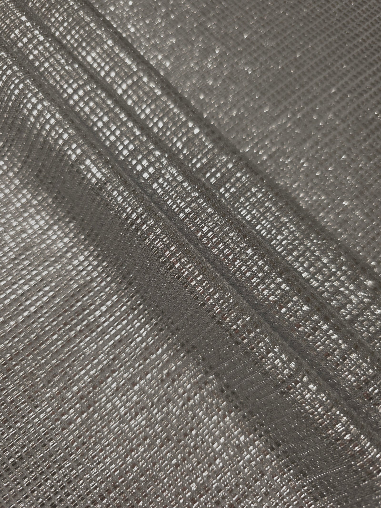 Layered Silver Gray Sheer Square Shimmer Stretch Tulle Fabric showing overlapping geometry, denser shimmer and translucent depth