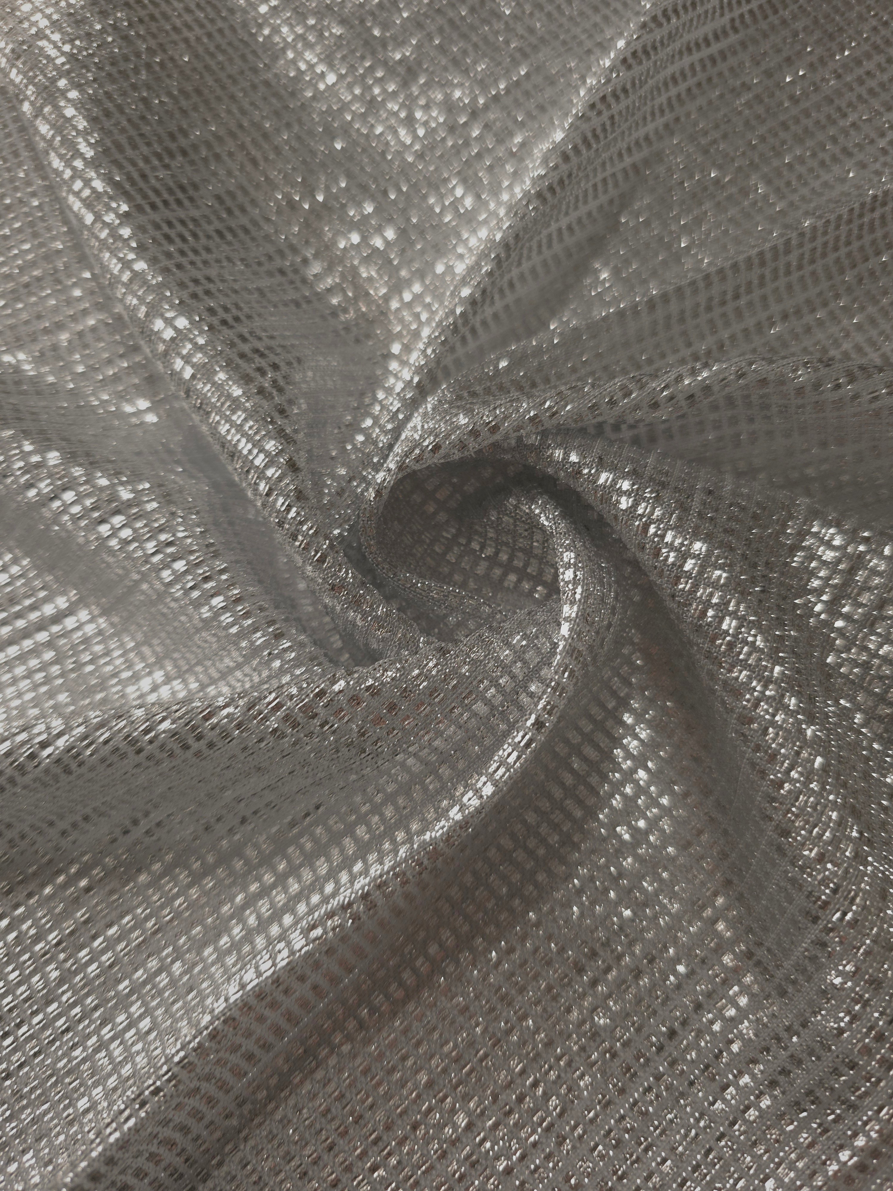 Swirl-draped Silver Gray Sheer Square Shimmer Stretch Tulle Fabric showing structured square reflections moving through soft folds