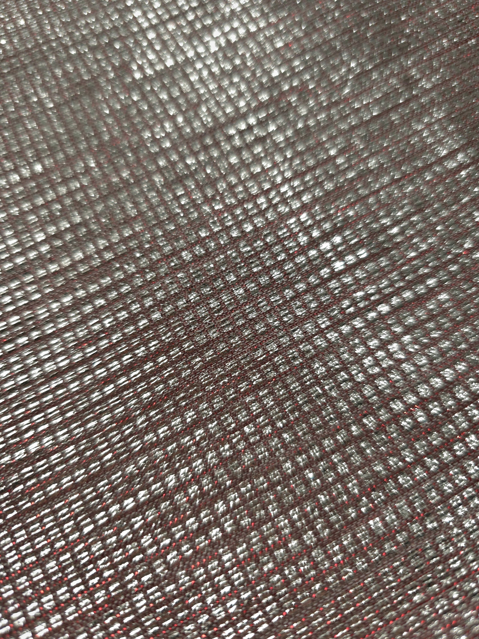Close-up of Silver Red Sheer Square Shimmer Stretch Tulle Fabric revealing the square shimmer repeat and fine transparent mesh