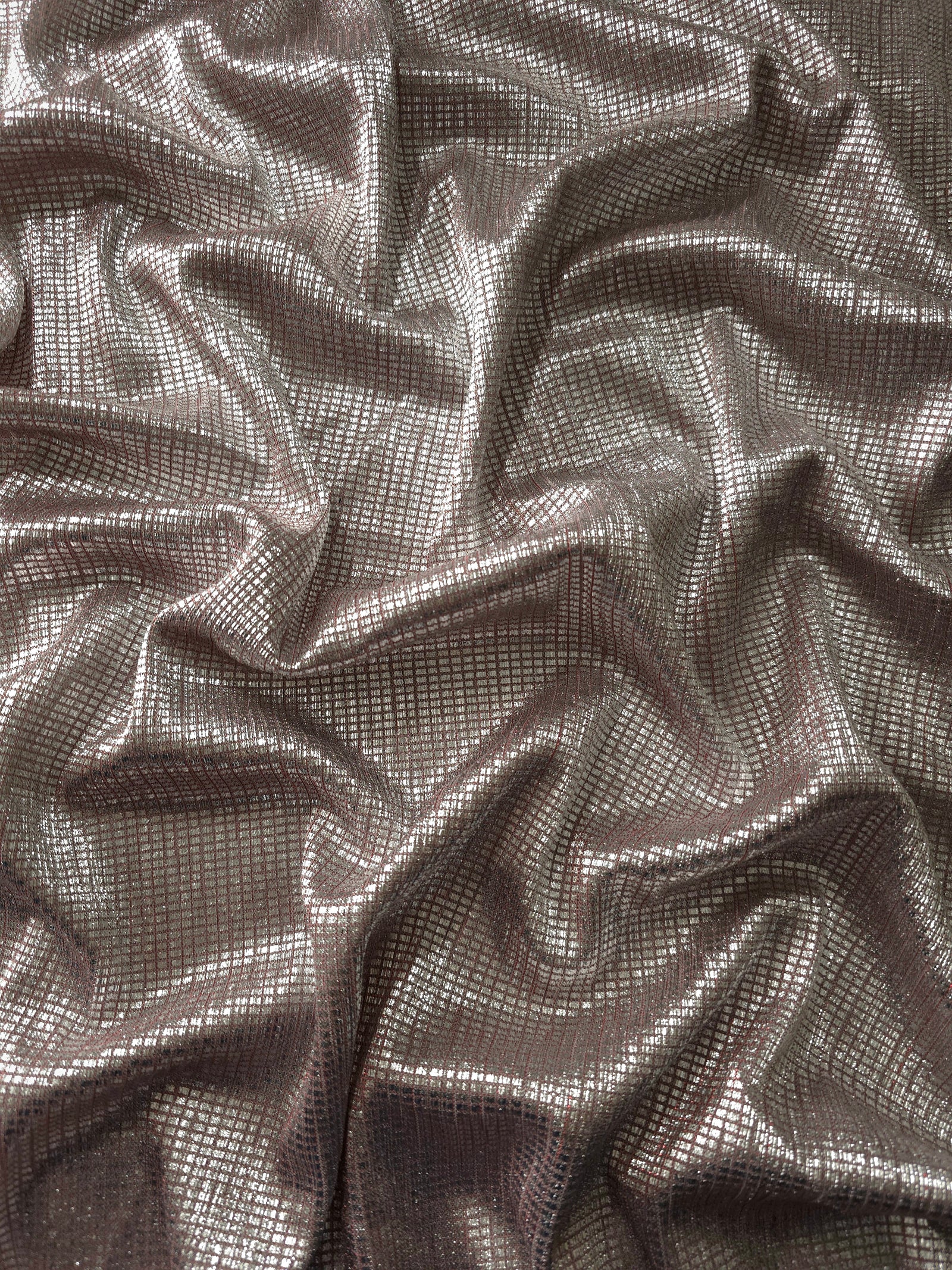 Draped Silver Red Sheer Square Shimmer Stretch Tulle Fabric showing a geometric reflective grid across fluid folds