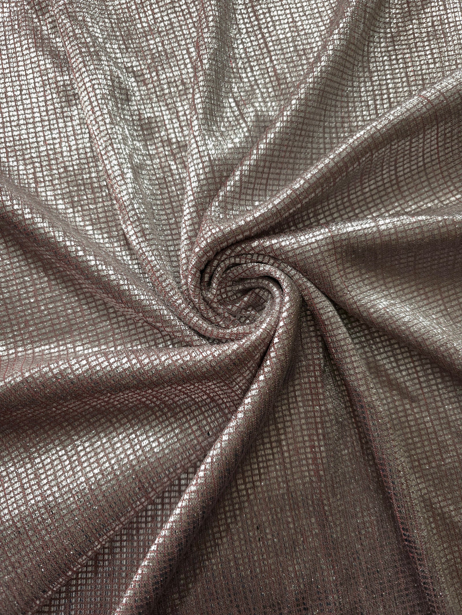 Swirl-draped Silver Red Sheer Square Shimmer Stretch Tulle Fabric showing structured square reflections moving through soft folds
