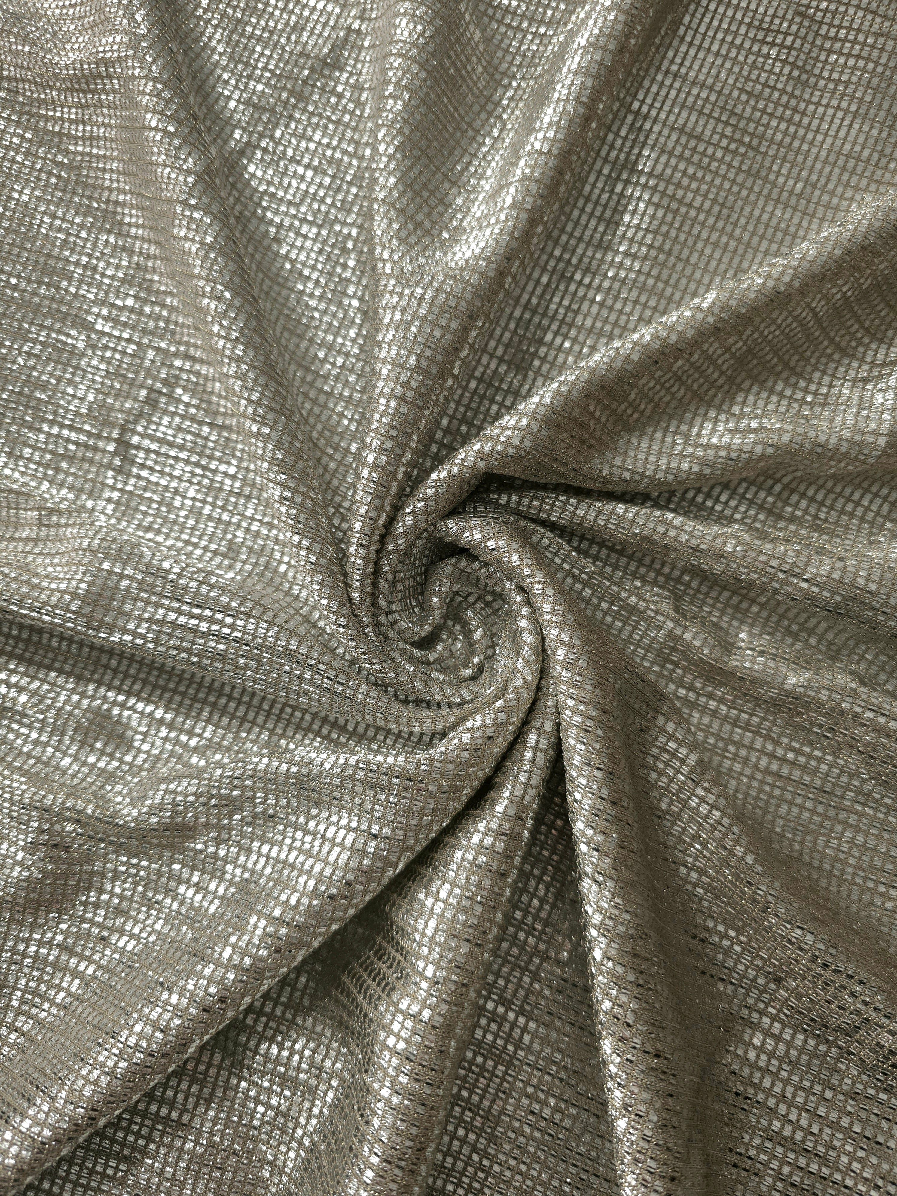 Swirl-draped Vanilla Cream Sheer Square Shimmer Stretch Tulle Fabric showing structured square reflections moving through soft folds