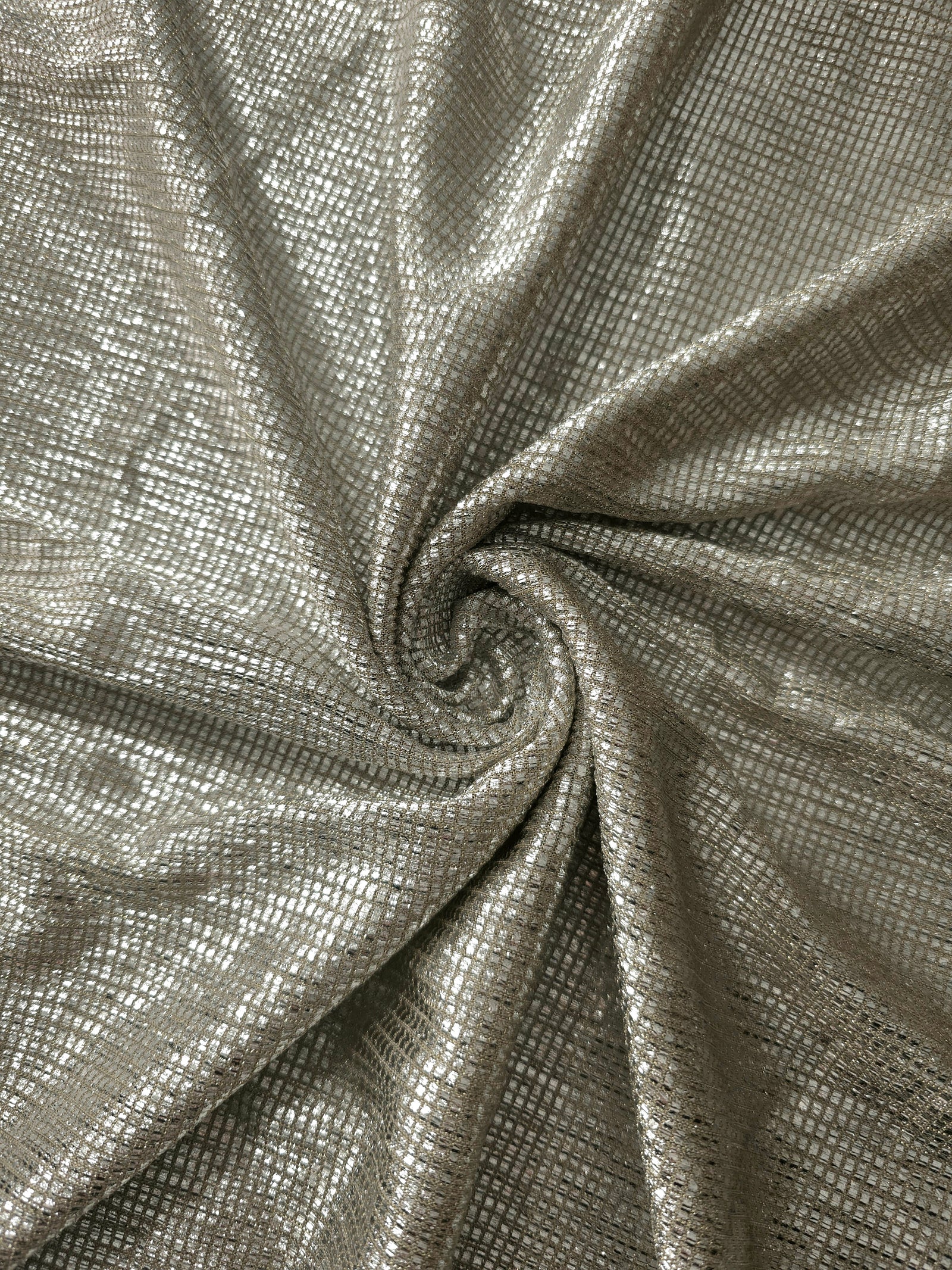 Swirl-draped Vanilla Cream Sheer Square Shimmer Stretch Tulle Fabric showing structured square reflections moving through soft folds