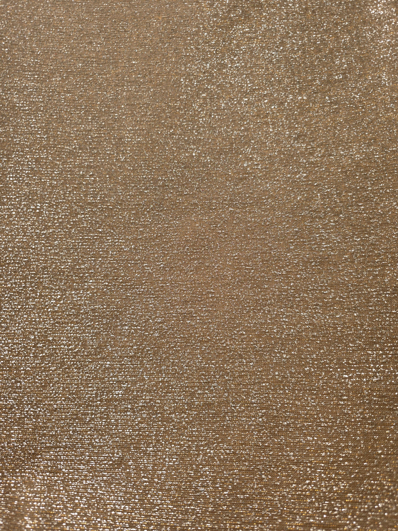 Surface detail of Antique Gold Sheer Glitter Stretch Tulle Fabric showing glitter coverage across the fine sheer tulle base