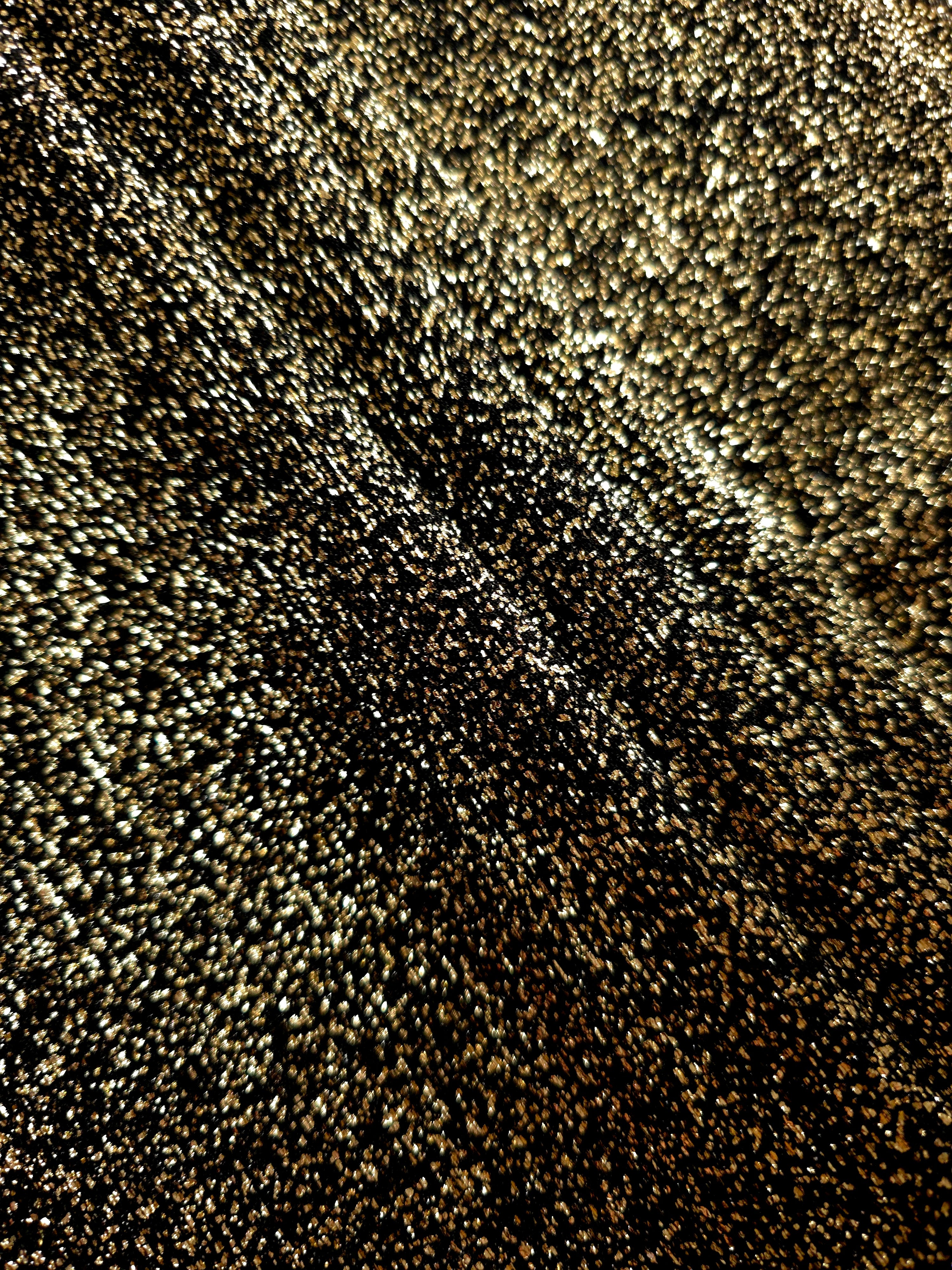 Layered Black Gold Sheer Glitter Stretch Tulle Fabric showing richer sparkle, soft depth and lightweight transparent folds